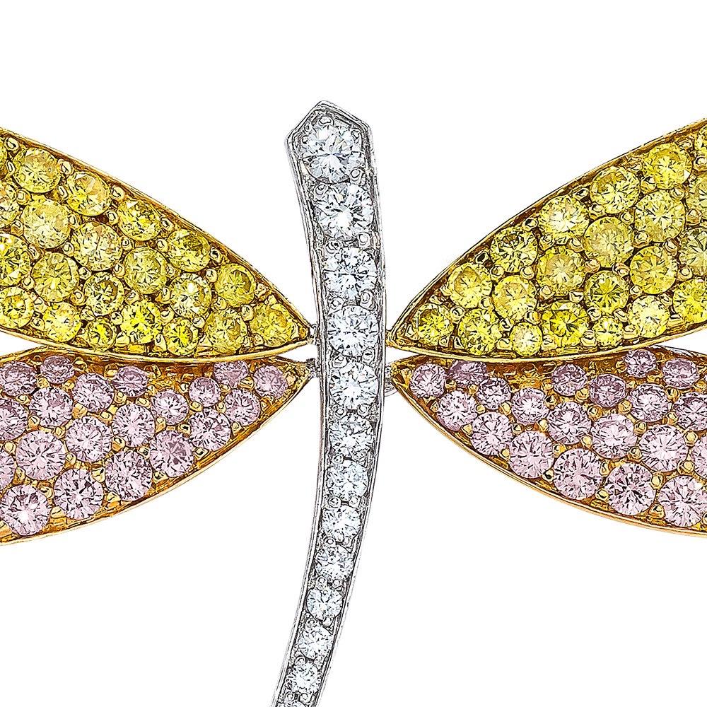 Dragonfly brooch crafted in 18-karat white and yellow gold and rose gold, pavé-set with yellow, pink and white round brilliant diamonds. The dragonfly has a pin back as well as a loop, it can be worn as a brooch or a pendant.
Stamped 18K 750

Yellow