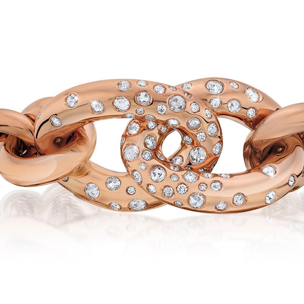 Made exclusively for Cellini by G. Verdi of Italy.
Designed in 18 karat hi-polished rose gold , the center links of this hard cuff bangle bracelet are set with scattered rose cut and brilliant cut diamonds. The inside measurement of this bracelet is