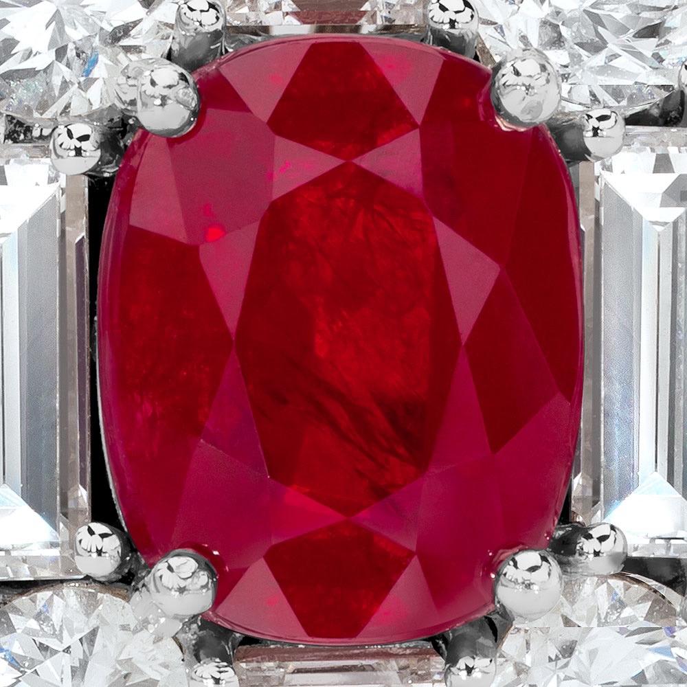 A magnificent 2.88 carat Burmese oval ruby is the centerpiece of this 18 karat white gold ring. The ruby is surrounded with a square entourage of 2.88 carats of pear and baguette shaped diamonds in this elegant setting.
Ring size 6.75 sizing