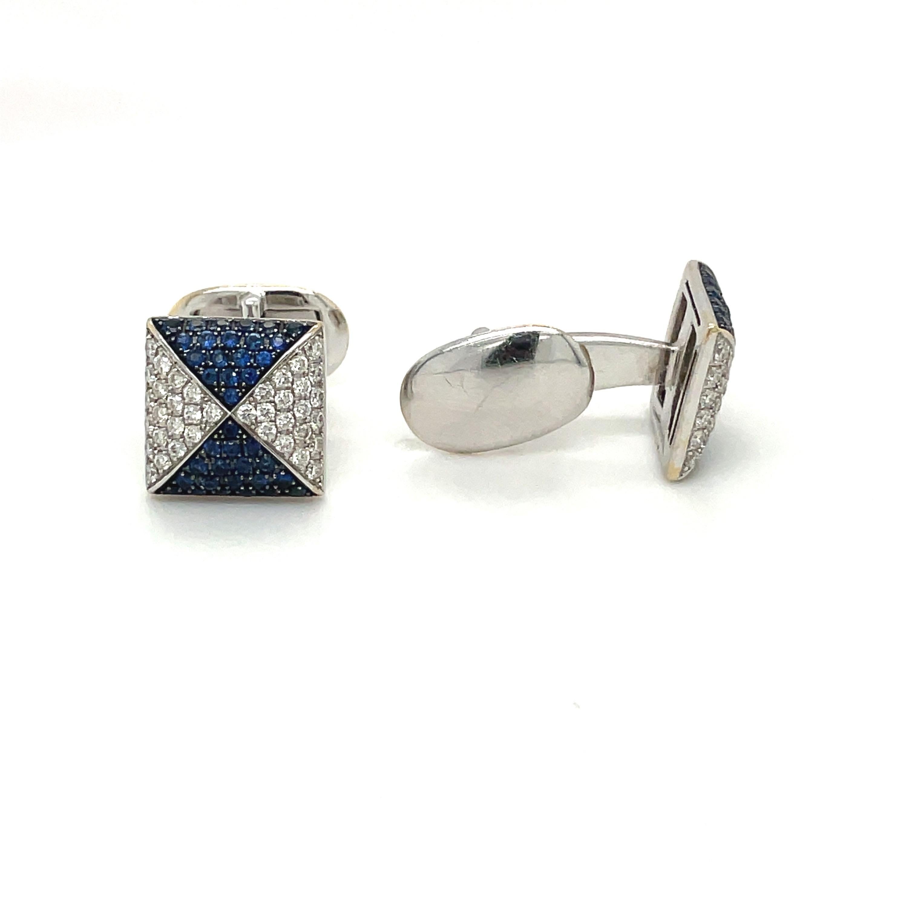 Exquisitely designed square 18 karat white gold cuff links. Four triangular shapes are pave set with brilliant diamonds and blue sapphires. The cuff links have a collapsible bar and measure 12.2mm.
Diamond weight 0.80 carats
Sapphire weight 1.00