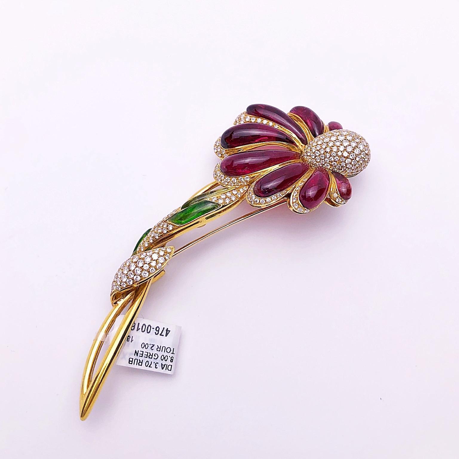 This intricate 18 karat yellow gold flower brooch was made exclusively for Cellini in Italy by Roberto Casarin. The petals are beautifully set with pave diamonds and hand carved and polished rubelite. The flower is further detailed with the bud,
