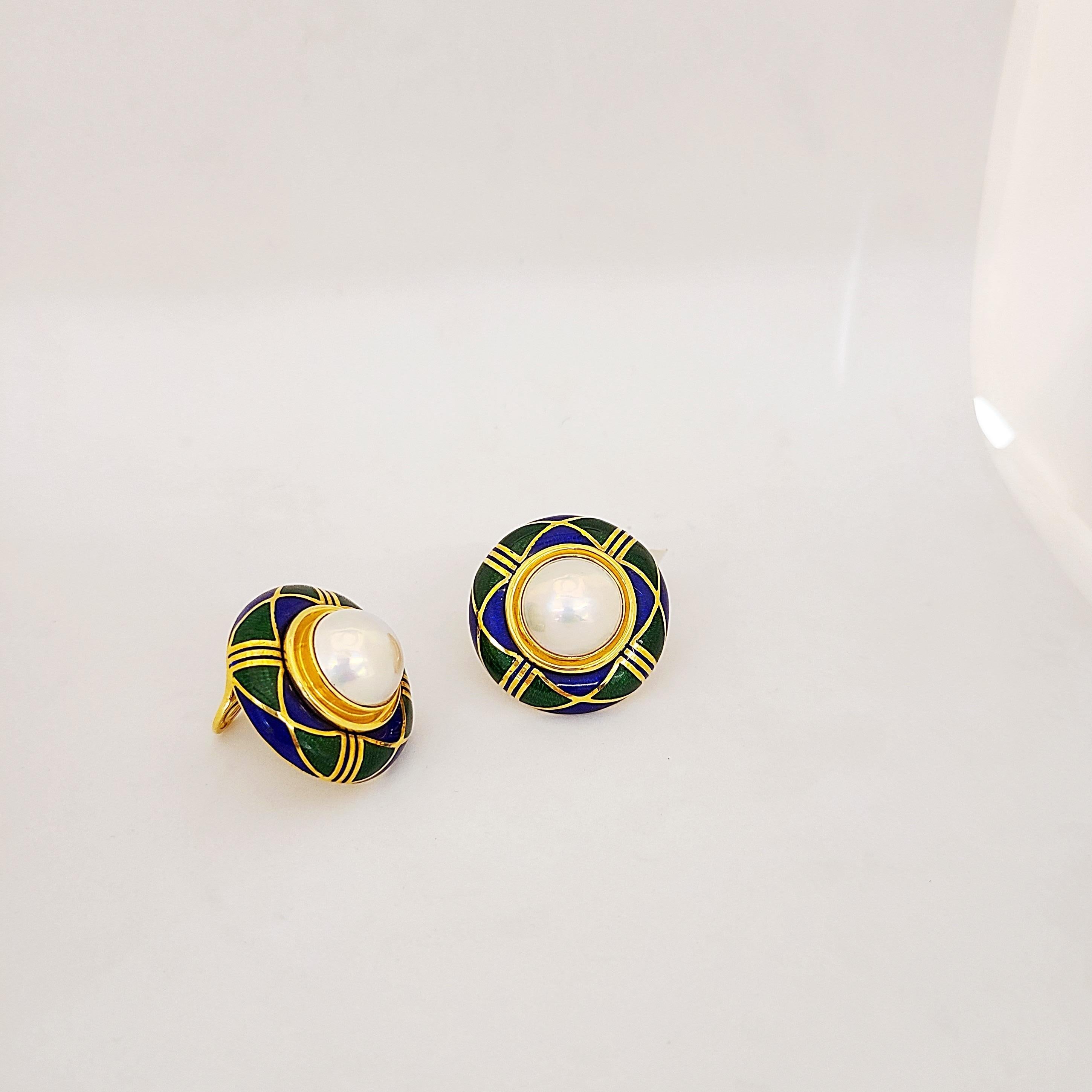18 karat yellow gold earclips with blue and green enamel and mabe pearl centers. The earrings measure 1.25