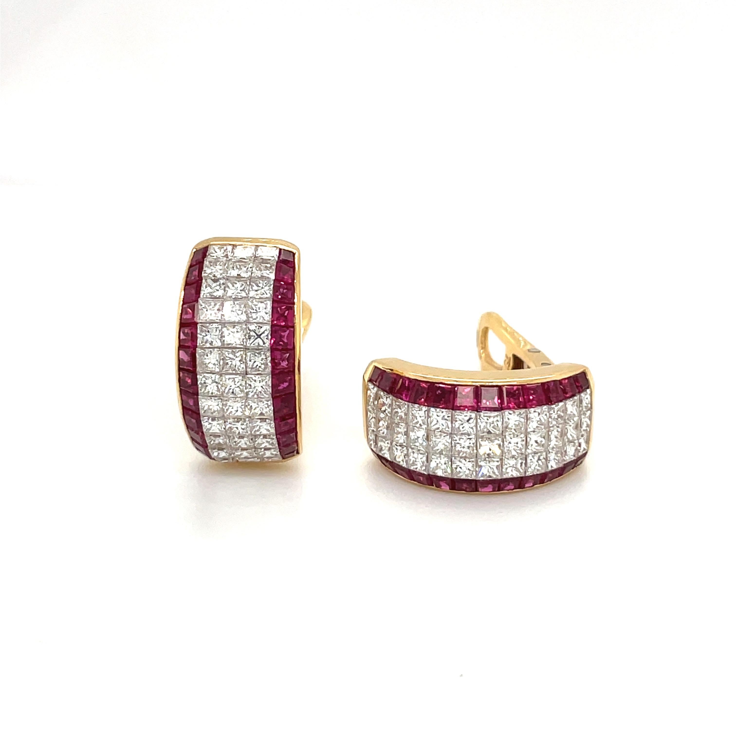 A very classic pair of half hoop earrings. These 18 karat yellow gold earrings are invisibly set with 3 rows of princess cut diamonds. The diamonds are bordered on either side by a row of square cut rubies. The earrings measure 3/4