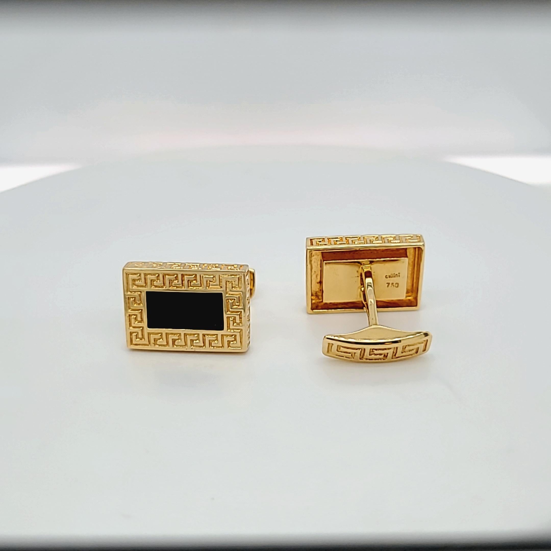 Classic  Cellini 18 karat yellow gold cuff links. The rectangular cuff links center black onyx and are bordered and edged with a Greek key motif. The bar back cuff links measure 7/8