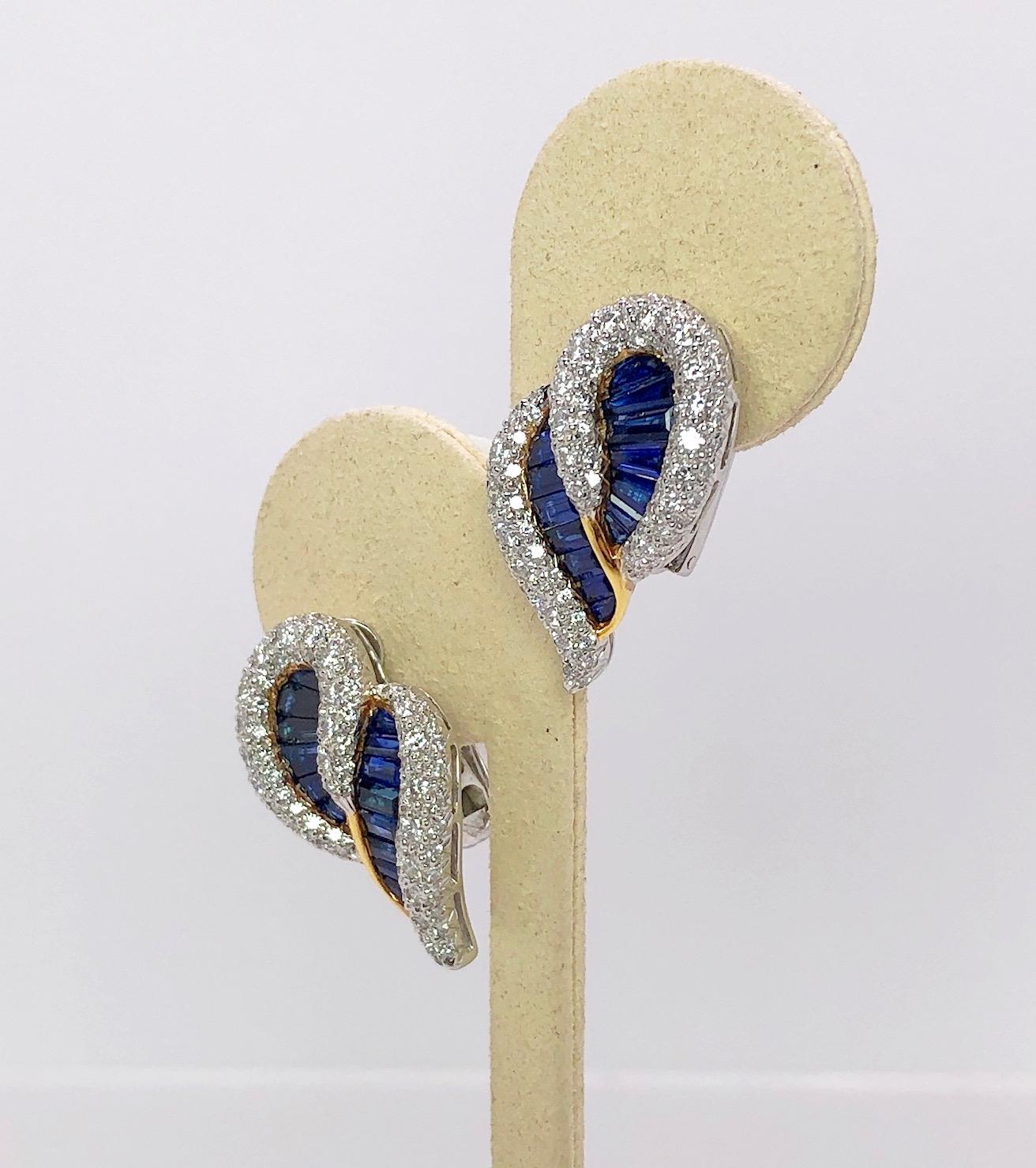 These beautifully crafted and designed double paisley earrings are set in 18 Karat yellow and white gold, with 4.46Cts. of Baguette cut blue sapphires, and 2.29Cts. of round brilliant diamonds. Clip earrings with collapsible post. 
Earrings measure