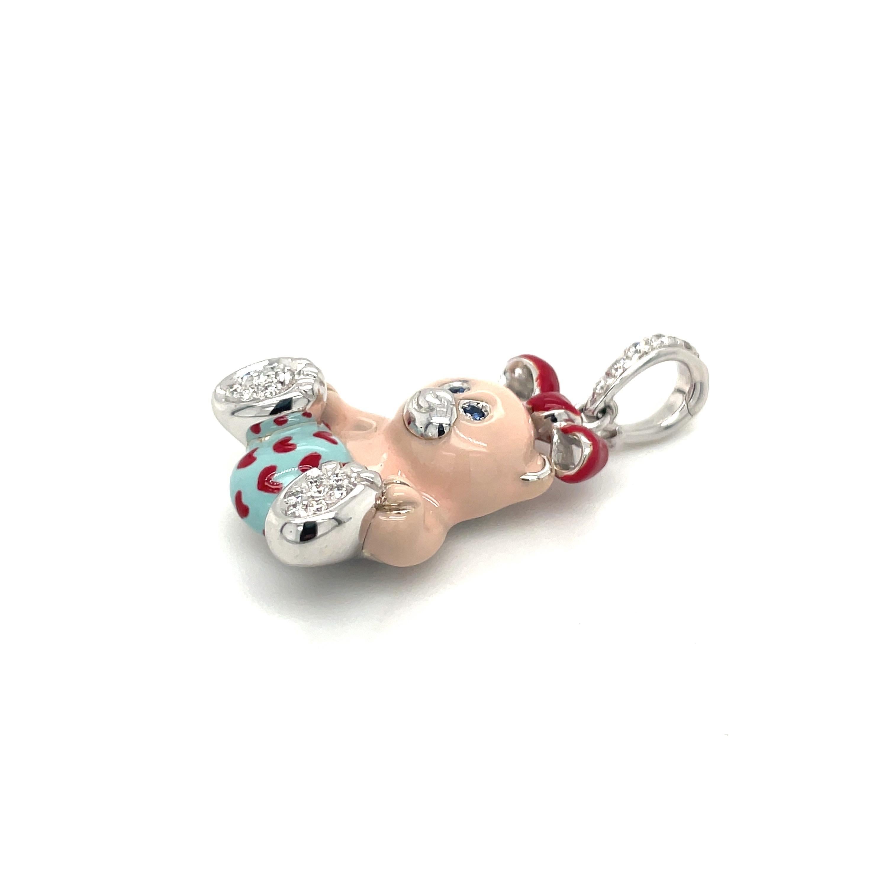 Just the cutest....Teddy bear charm made exclusively for Cellini by Ambrosi of Italy.

This 18 karat white gold teddy bear is set with round brilliant pave diamonds on her paws . She has blue sapphire eyes . Her body is light pink enamel and her