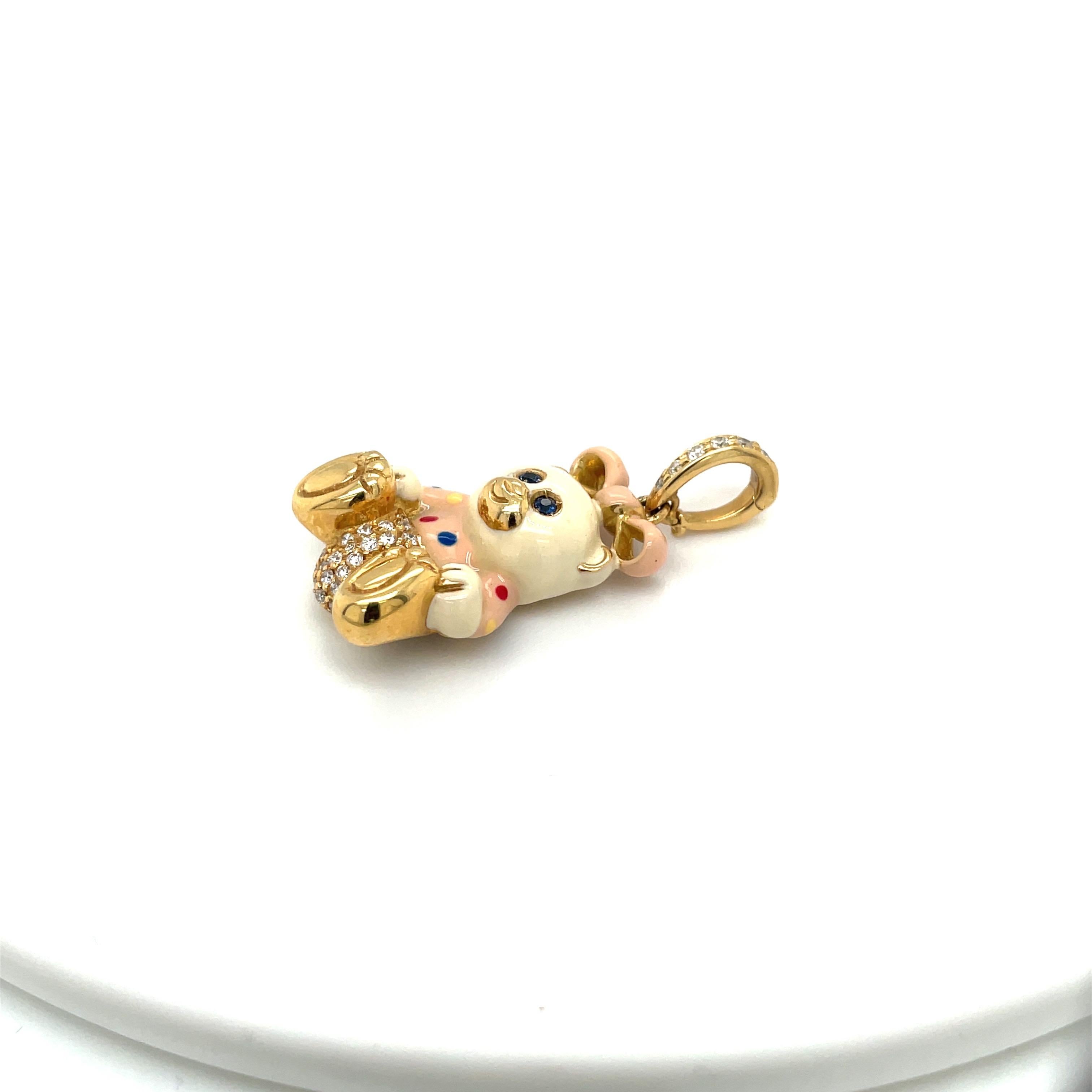 Just the cutest....Teddy bear charm made exclusively for Cellini by Ambrosi of Italy.

This 18 karat yellow gold teddy bear is set with a round brilliant pave diamond diaper. She has blue sapphire eyes . Her body is a milky white enamel and her