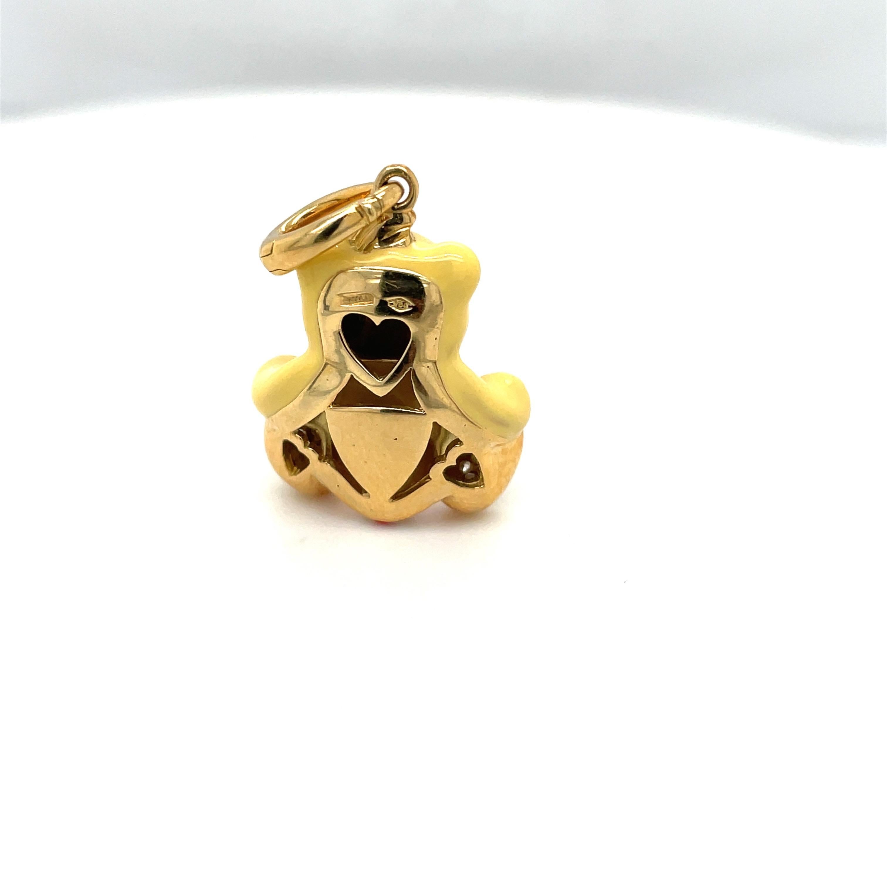 Just the cutest....Teddy bear charm made exclusively for Cellini by Ambrosi of Italy.

This 18 karat yellow gold teddy bear is set with round brilliant pave diamonds on his paws. He has blue sapphire eyes.His body is yellow enamel and his outfit is