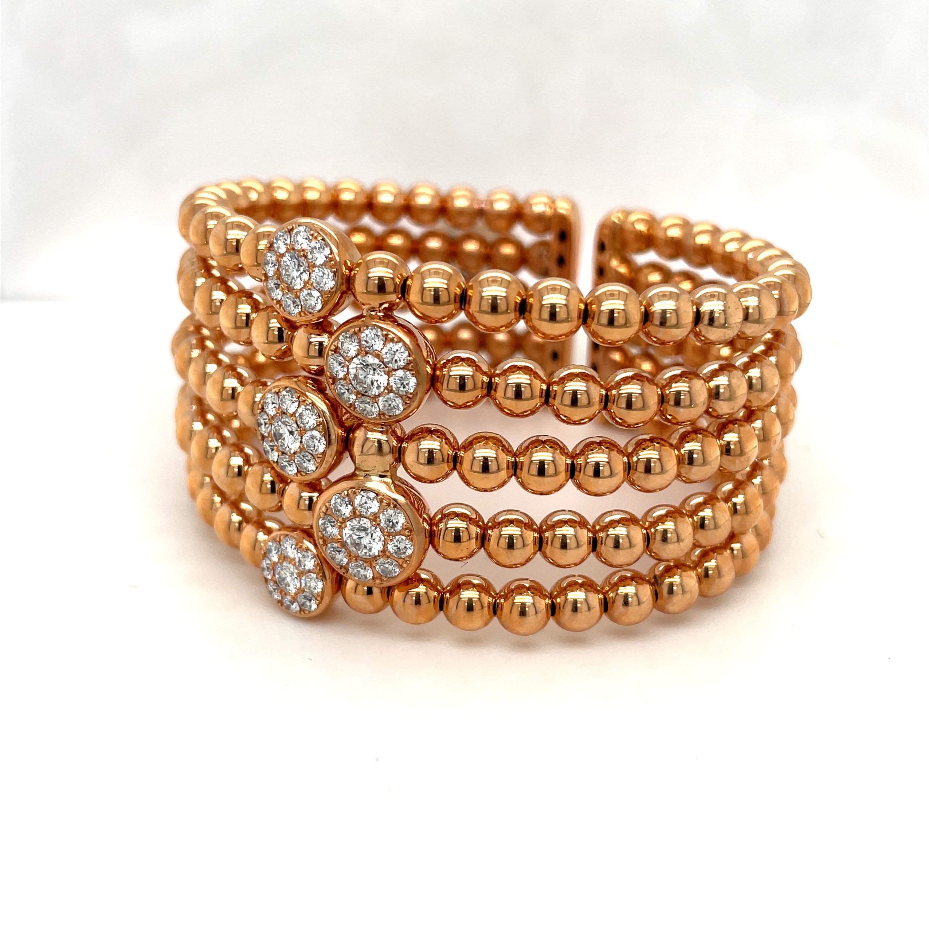 This comfortable and flexible open-spring cuff is composed of five rows of 18-karat rose gold beads, and features a center row with 5 pavé diamond discs. Round brilliant diamonds: 2.19 total carats.
Gorgeous and super versatile bracelet - Can be