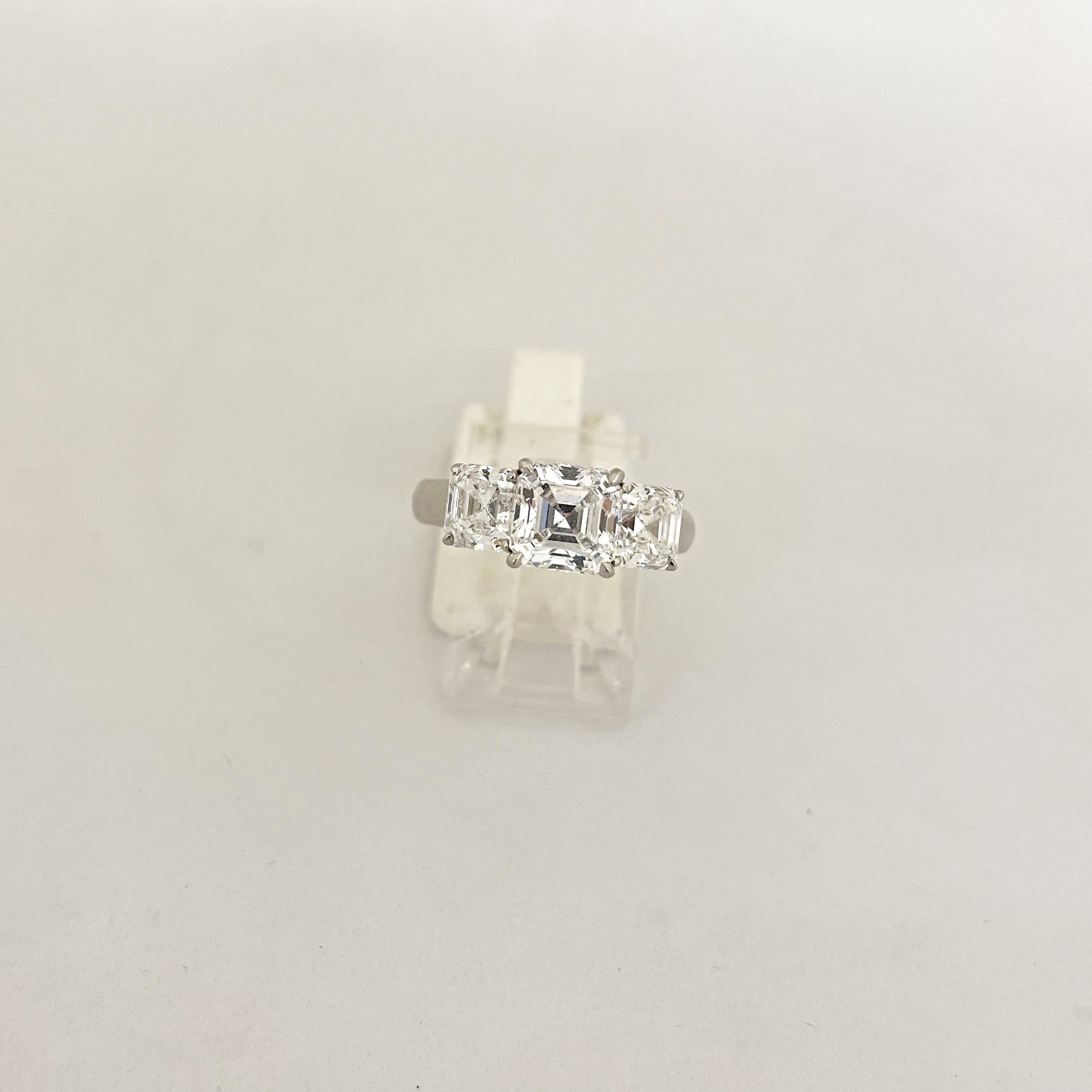 Cellini GIA Certified 3 Stone Square Emerald Cut E color Diamond Ring For Sale 2