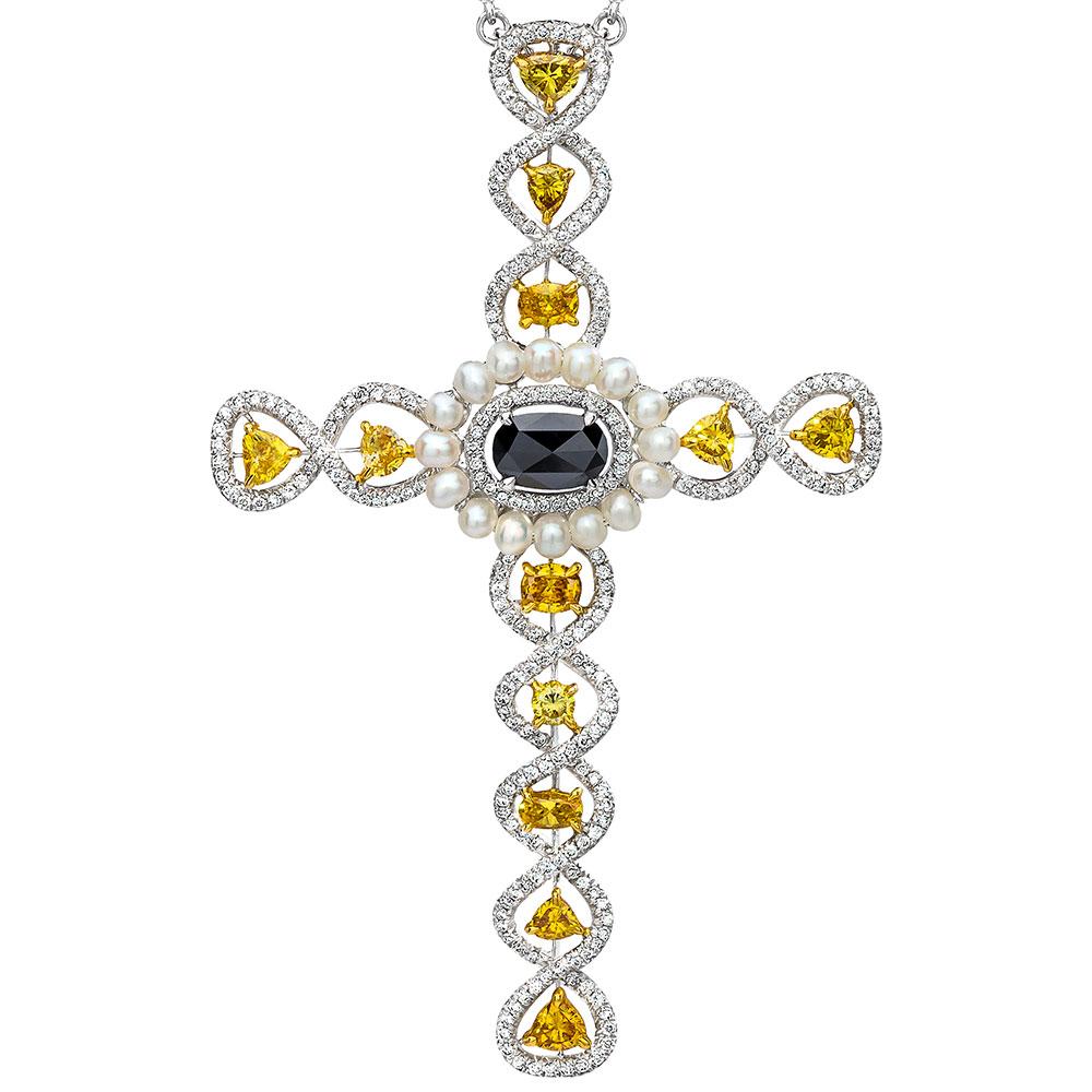 Italian crafted for Cellini Jewelers, This beautiful one of a kind diamond cross pendant is composed of an array of fancy colored yellow diamonds totaling 1.34 carats, in shapes of ovals, rounds, and trillions. The cross center is a rose cut oval