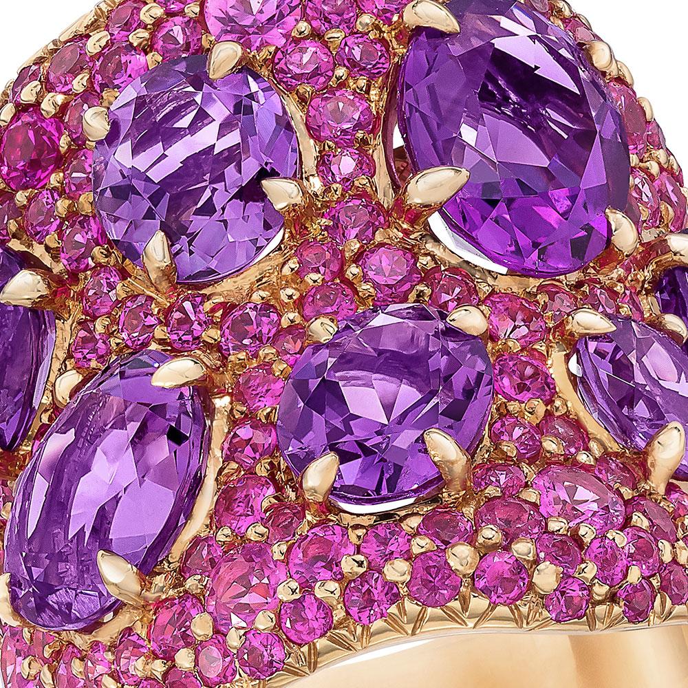 This beautiful 18 Karat Rose Gold ring featured 5.99 carats of Amethysts set in 4.05 carats of pave pink sapphires. 
Ring size 7, can be sized upon request. 
Appraisal upon request. 
The length of the ring measures 1