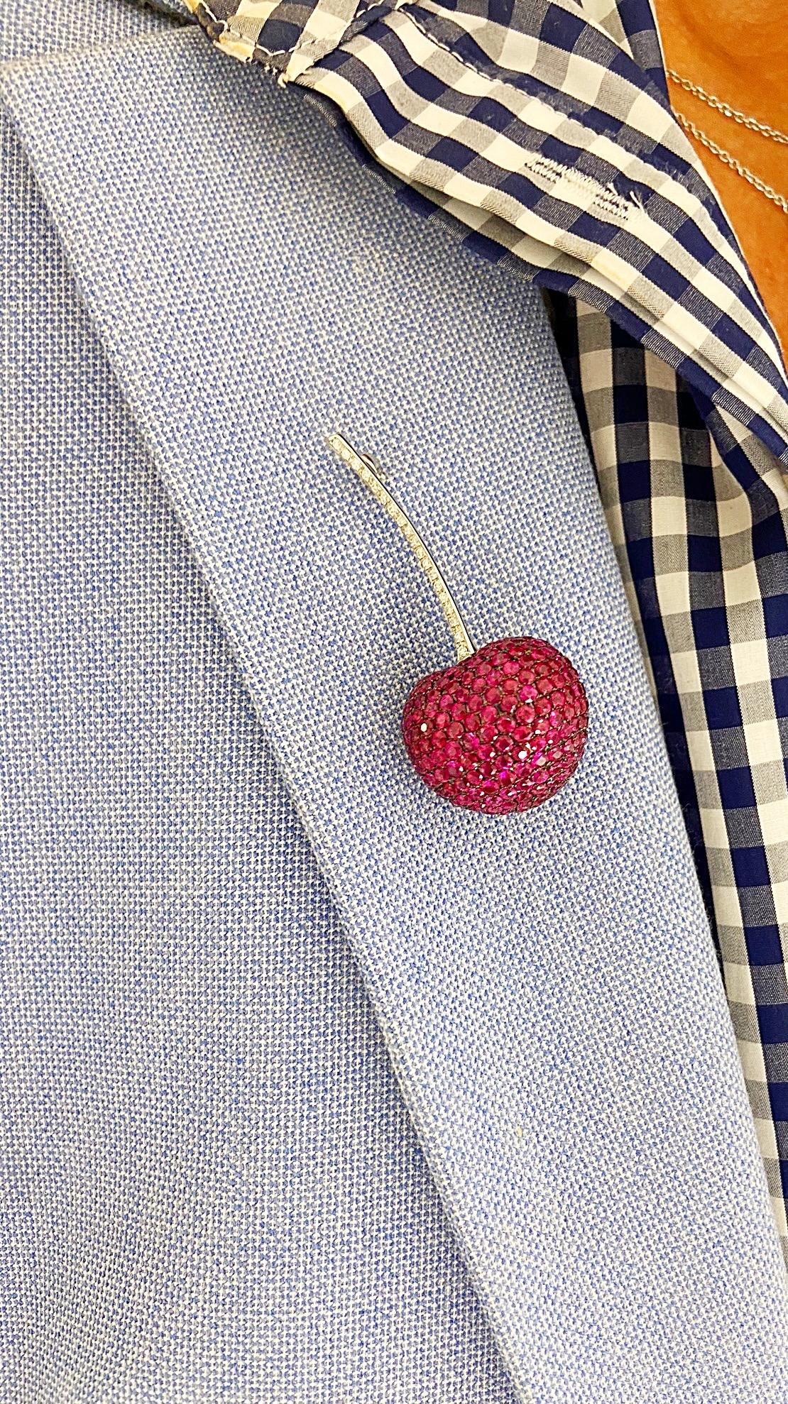Made exclusively for Cellini Jewelers NYC .This lovely 18 karat white gold cherry brooch is meticulously set with round Rubies for the fruit & round Diamonds for the stem. The cherry measures 2