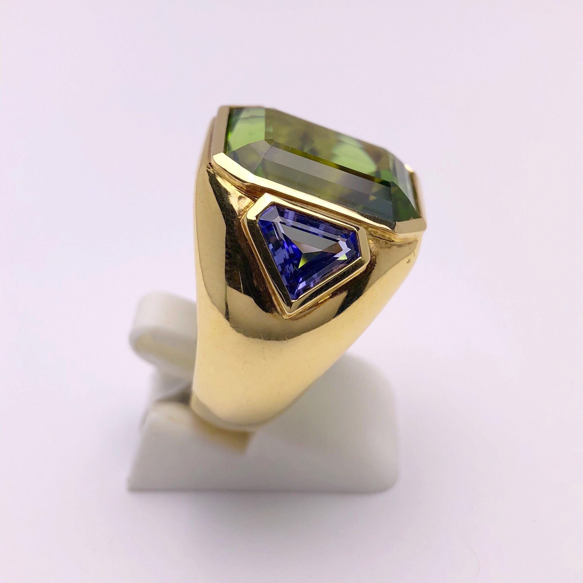 Emerald Cut 18 Karat Yellow Gold, 15.33 Carat Peridot and 1.87 Carat Tanzanite Ring