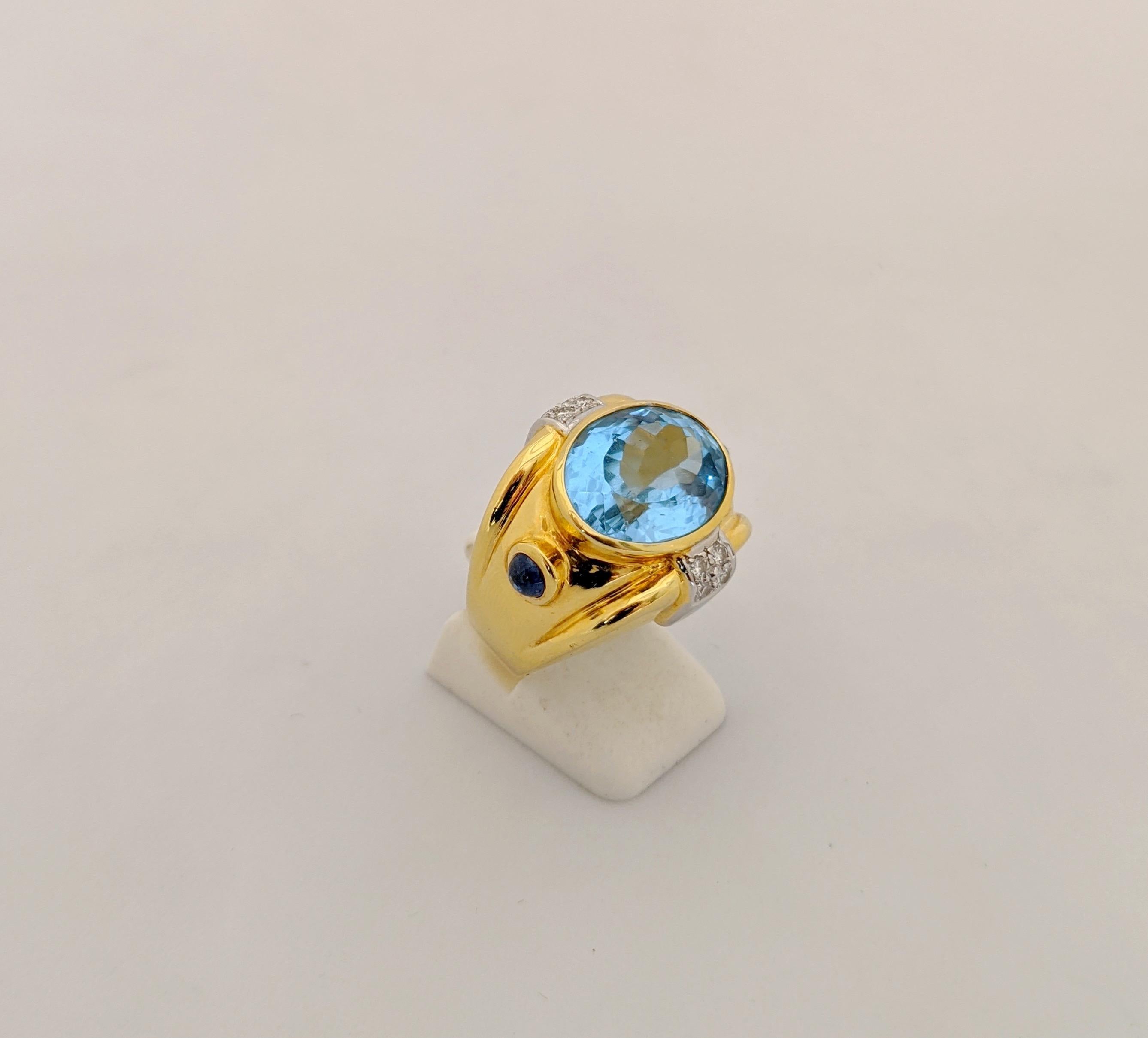 18 Karat Yellow Gold and 12.23 Carat Oval Blue Topaz Ring 1