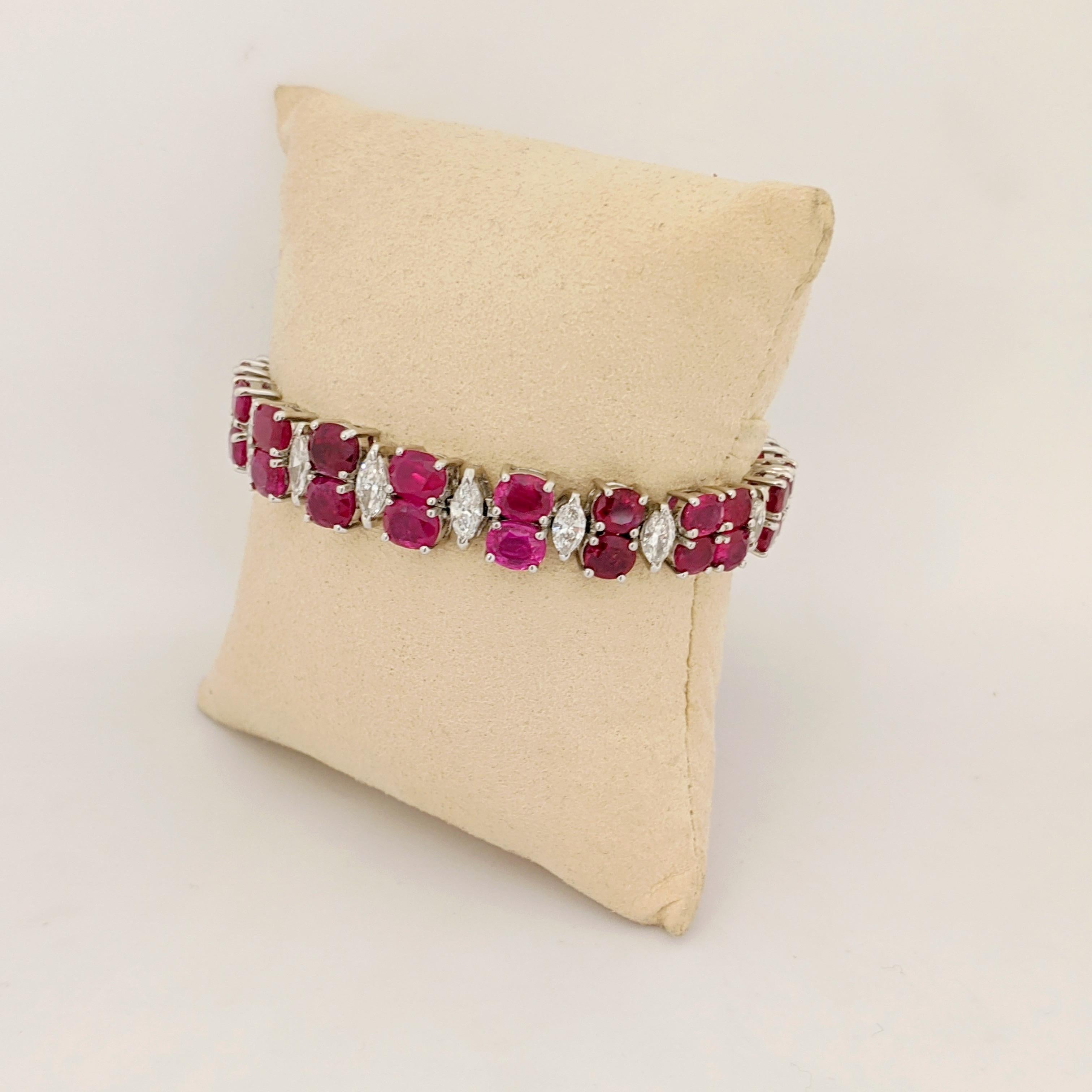 AN IMPORTANT RUBY AND DIAMOND BRACELET.
 The graduating bracelet is designed with  two rows of oval Burmese Rubies with single Marquis Diamond connections. The magnificent stones are set in a handmade Platinum bracelet mounting made exclusively for