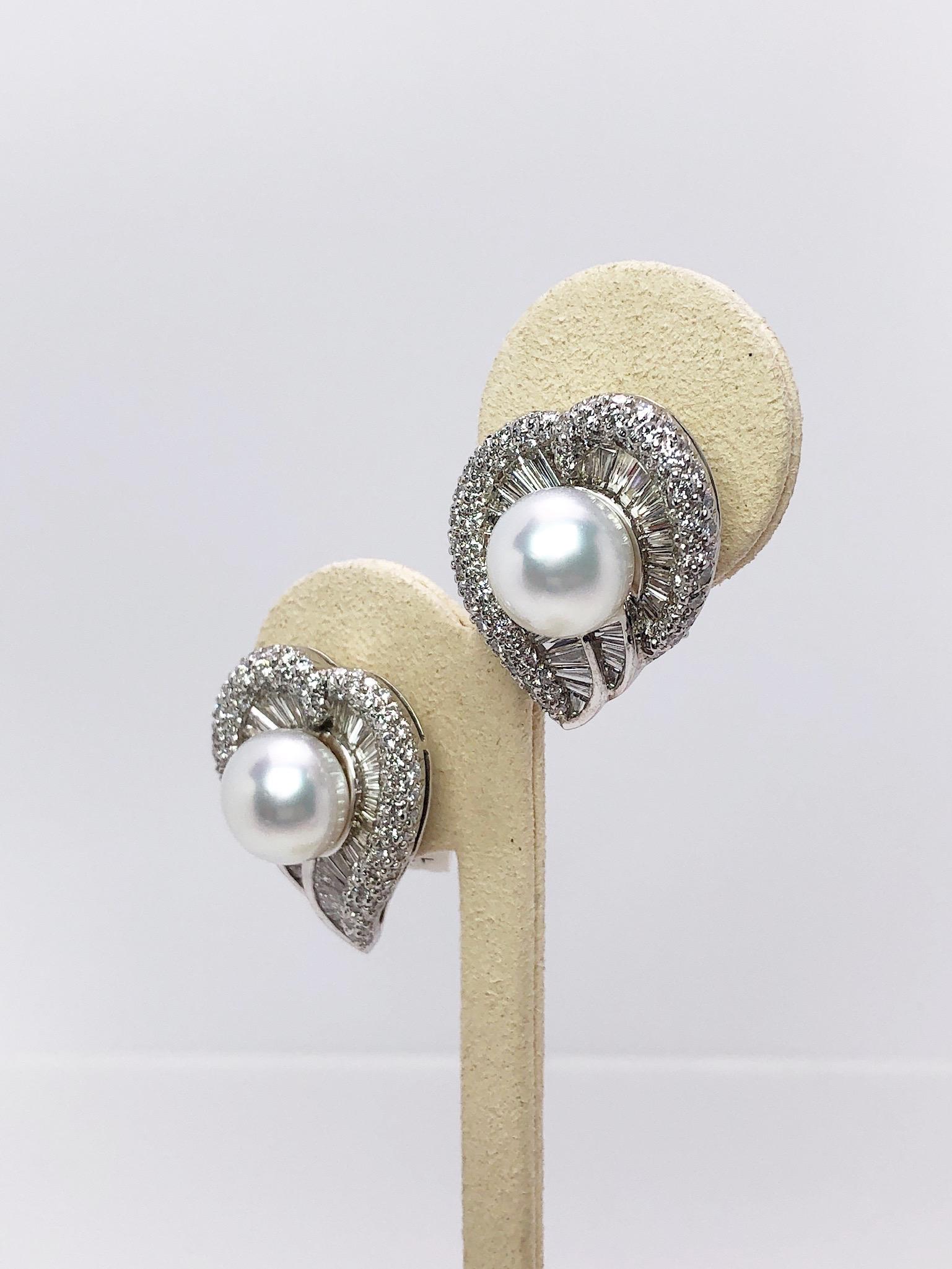 Cellini exclusive earrings.
These earrings are designed as a graceful leaf shape. They are set with Tapered Baguette Cut and Round Brilliant Diamonds. The earrings center 11.5 mm South Sea Pearls. The earrings are pierced with posts and a clip , but