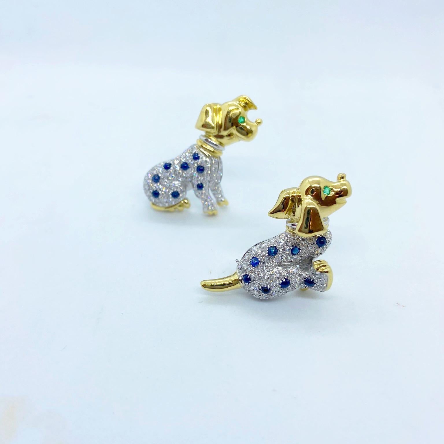 18 karat gold brooch designed as a dalmatian. dog running. The white gold body is set with pave diamonds and scattered cabochon blue sapphires. The head and paws are shiny yellow gold and the eye is set with a round emerald.
Diamond weight 0.98