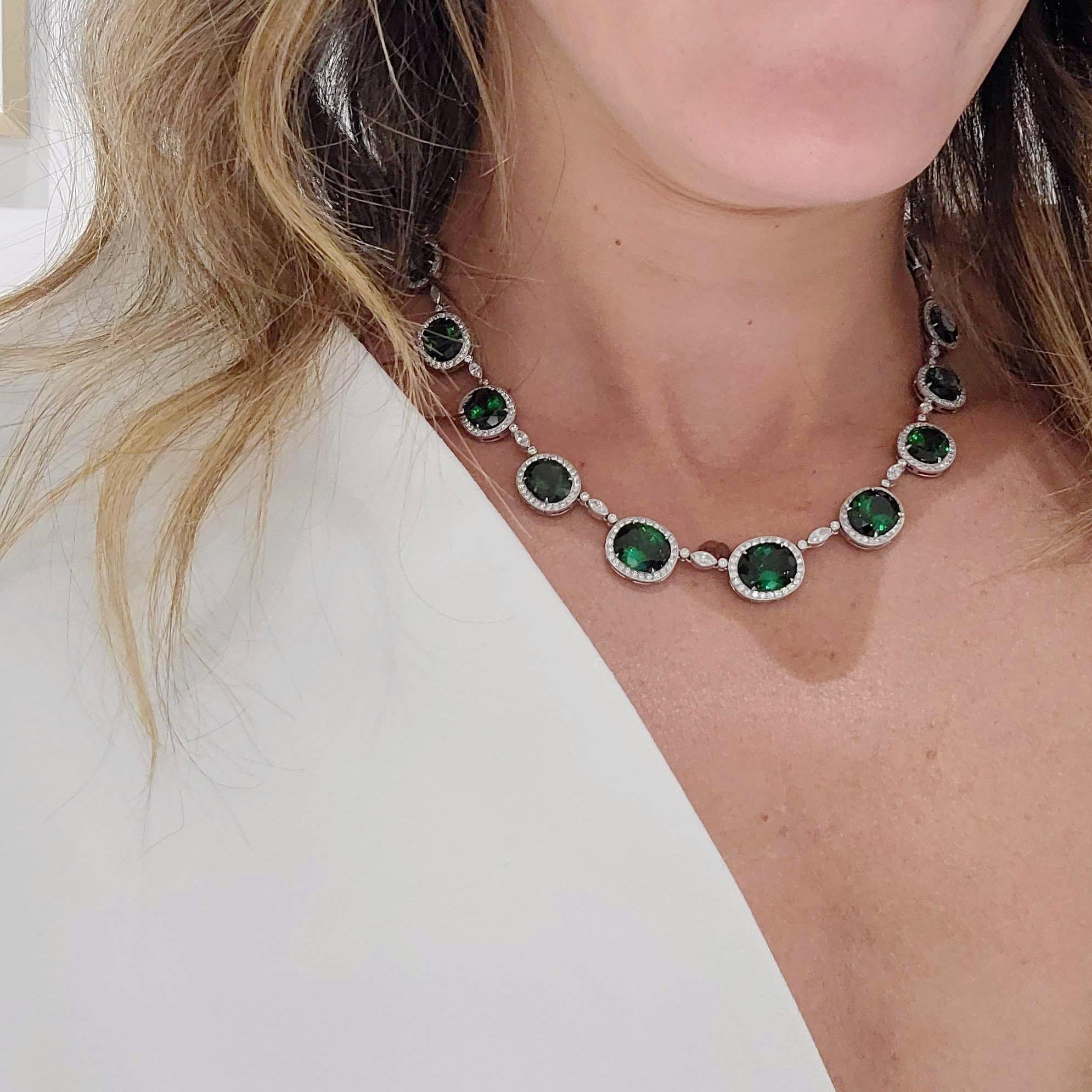 Magnificent platinum necklace. This necklace is designed with 22 oval Chrome Tourmalines. Each stone is framed with round brilliant Diamonds. A  single marquis and two round brilliant Diamonds are the connectors. The total length of the necklace is