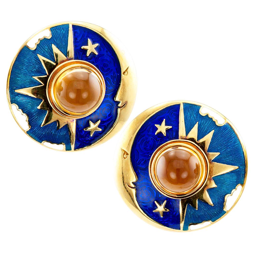 Sun moon and star gold earrings with enamel and citrines by Cellini circa 1980. Visually striking, these colorful earrings feature a pair of cabochon citrines as focal points for representations of heavenly bodies that are all too familiar to us
