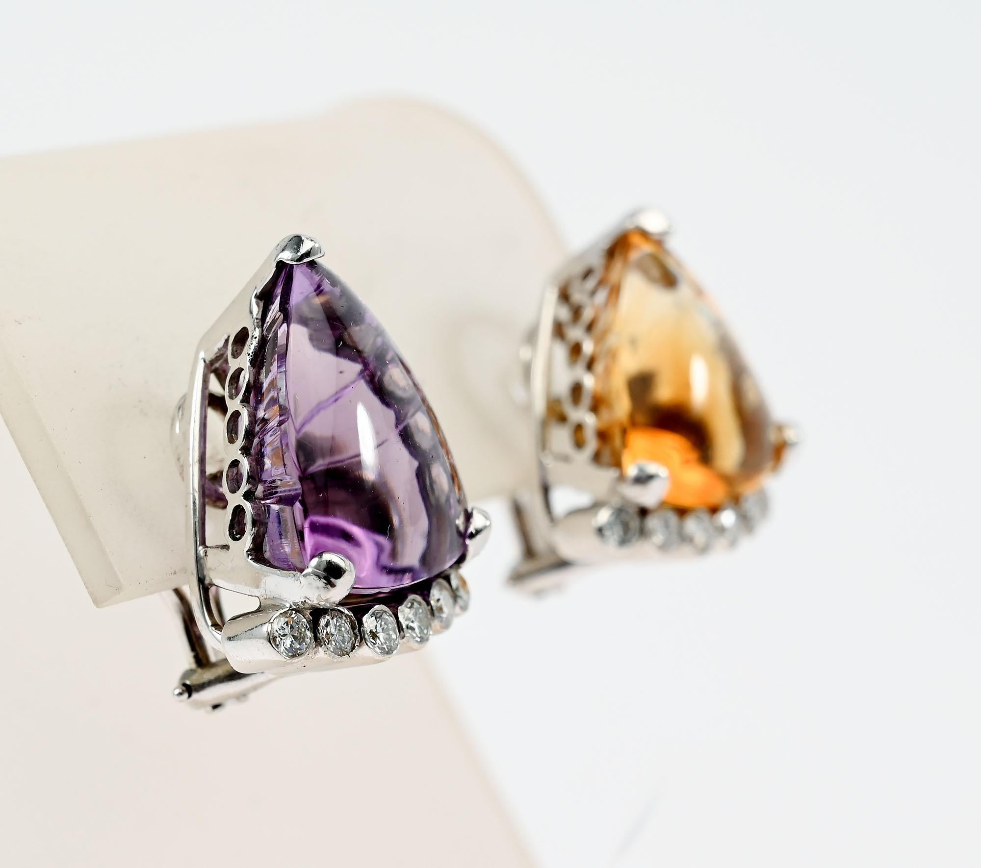 The whimsical yet elegant earrings by Cellino are fraternal twins. One has an amethyst and the other a citrine. Both have 6 round diamonds at the bottom. The amethyst is a slightly larger stone. It measures 3/4
