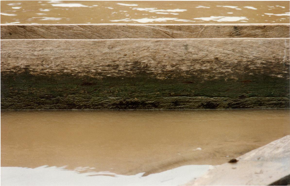 Man in Canoe. Nude. Photograph printed on canvas, Mounted in strechers - Black Color Photograph by Celso José Castro Daza