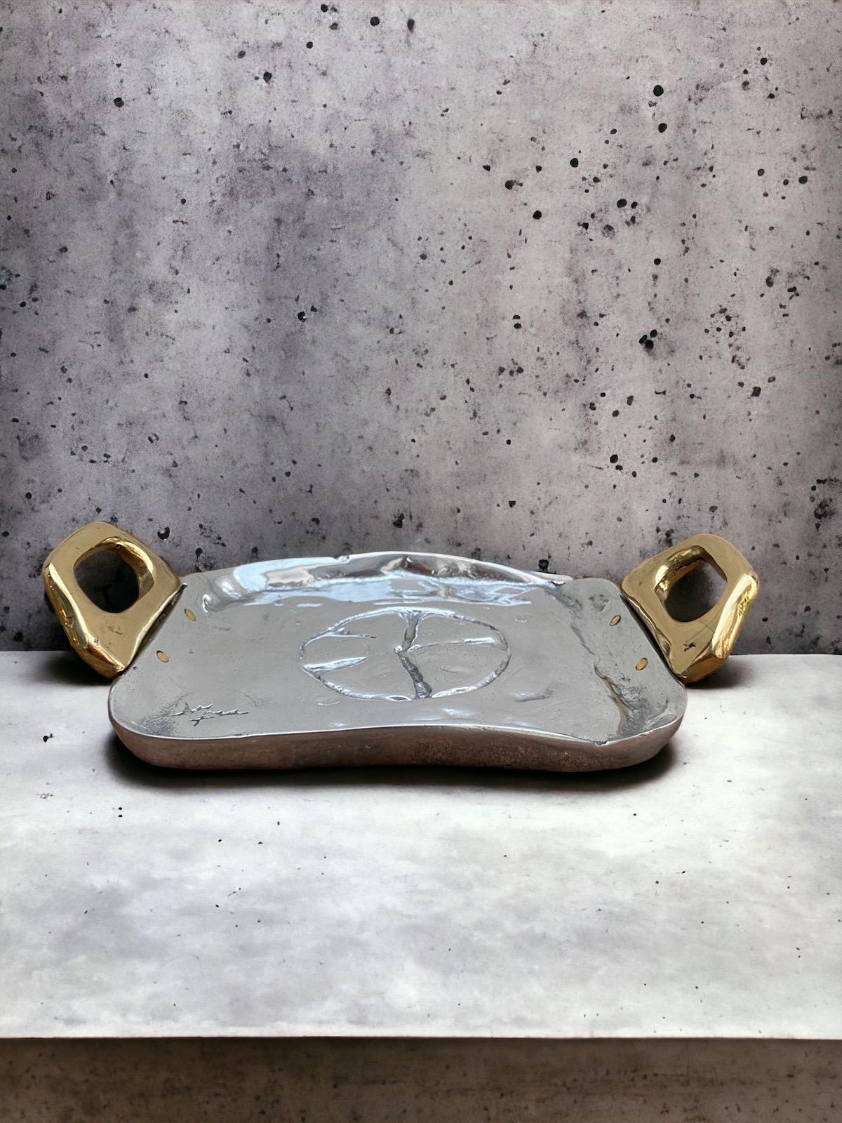 The decorative Celtic Card Tray was created by David Marshall, it is made of sand cast aluminum and sand cast brass.Makes a beautiful Wedding or Company Gift.
Handmade, mounted and finished in our foundry and workshop in Spain from recycled