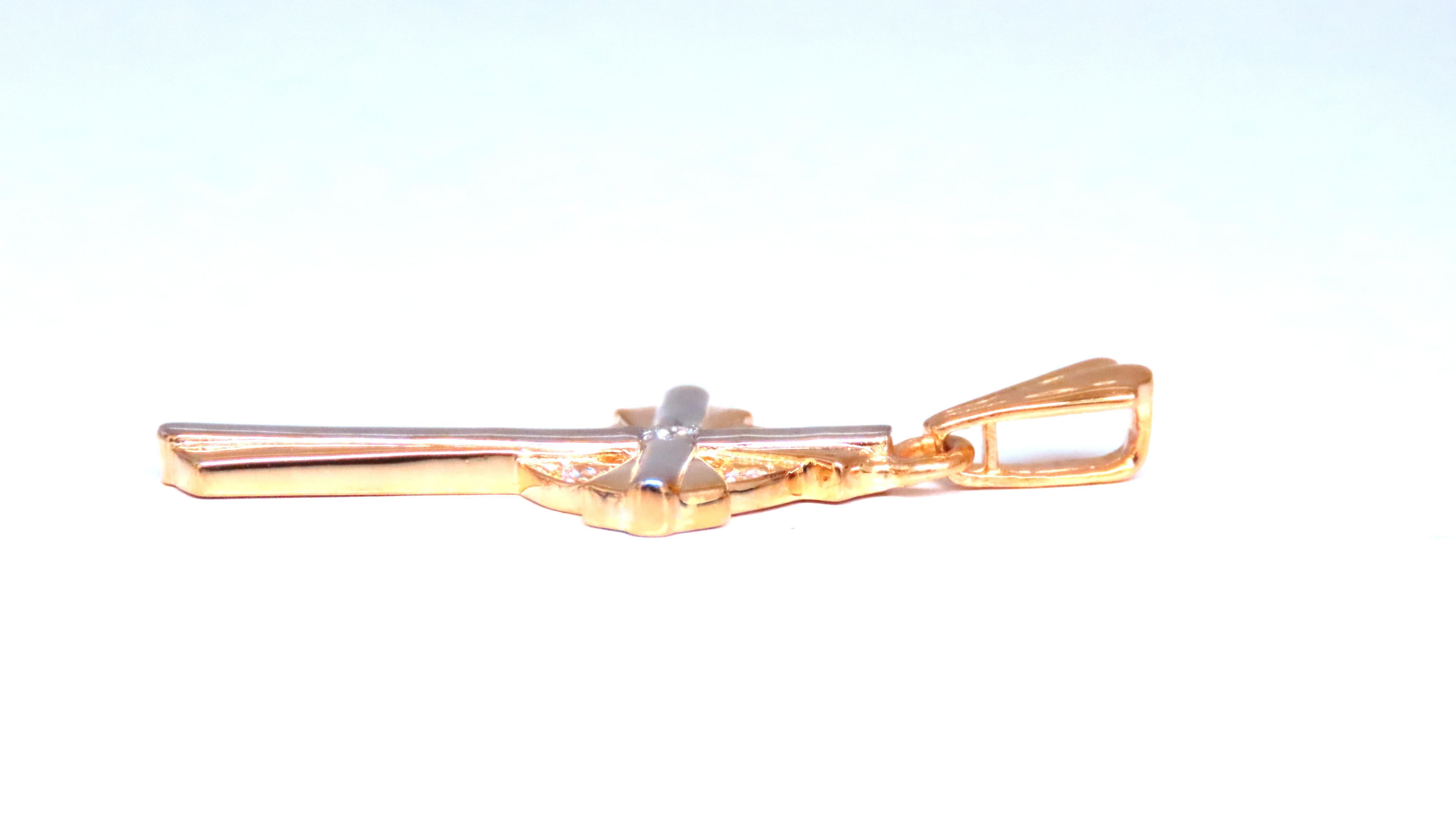 .12ct natural diamond cross pendant 
h-color vs-2 clarity 
14kt yellow gold 2.7 grams 
1.4 x .258 inch