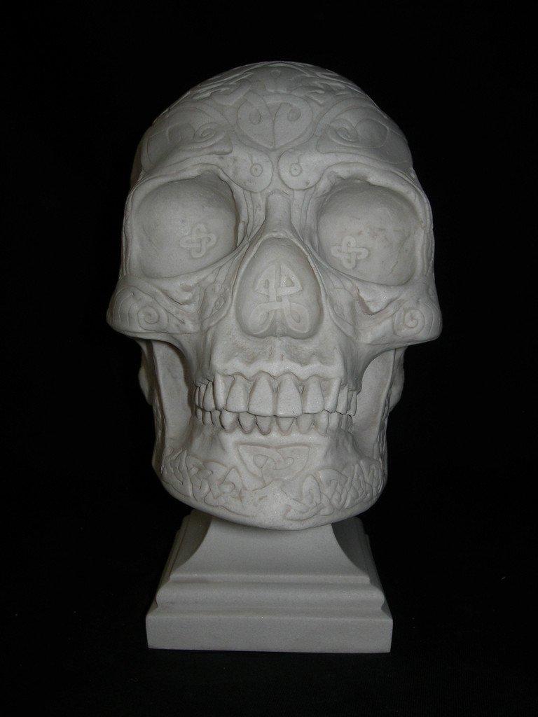 A unique Celtic Knotwork skull marble sculpture, 20th century.
Human skull, carved with Celtic Knotwork.
Embellishing a human skull.

The ornate Celtic skull dates from between the 6th and 8th centuries BC.