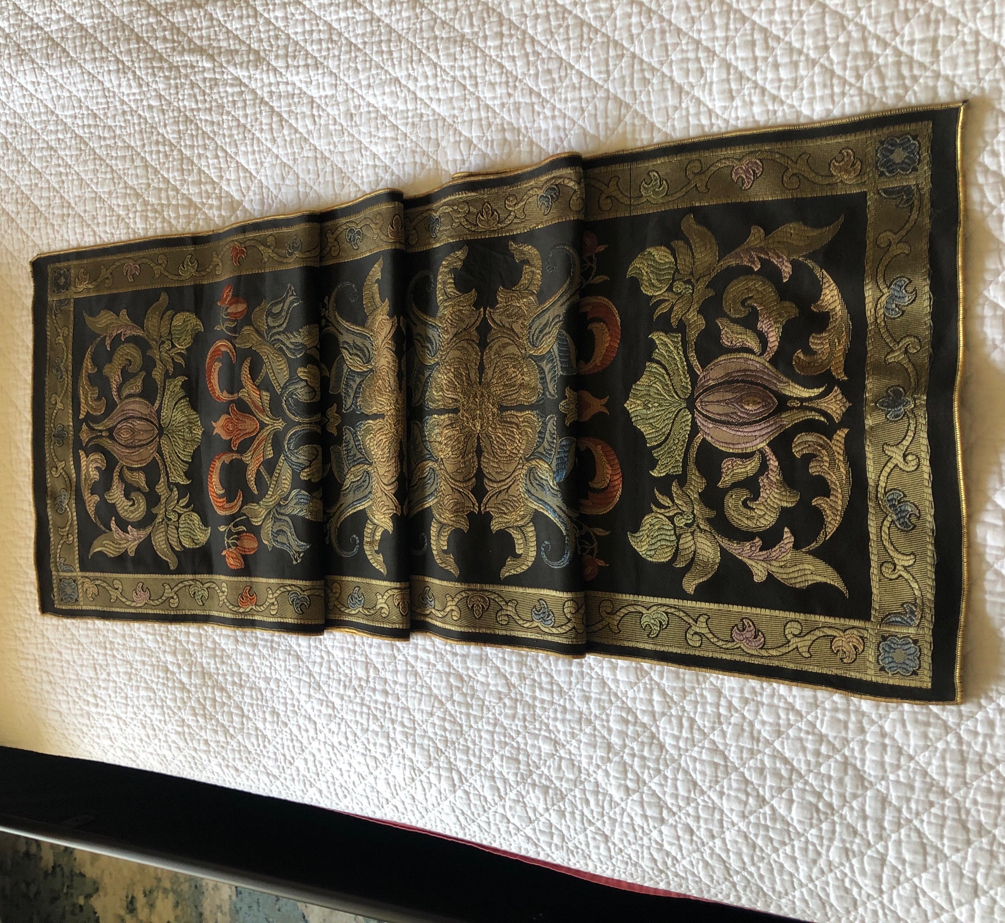 Celtic style woven gold and green table runner.
Size: 15