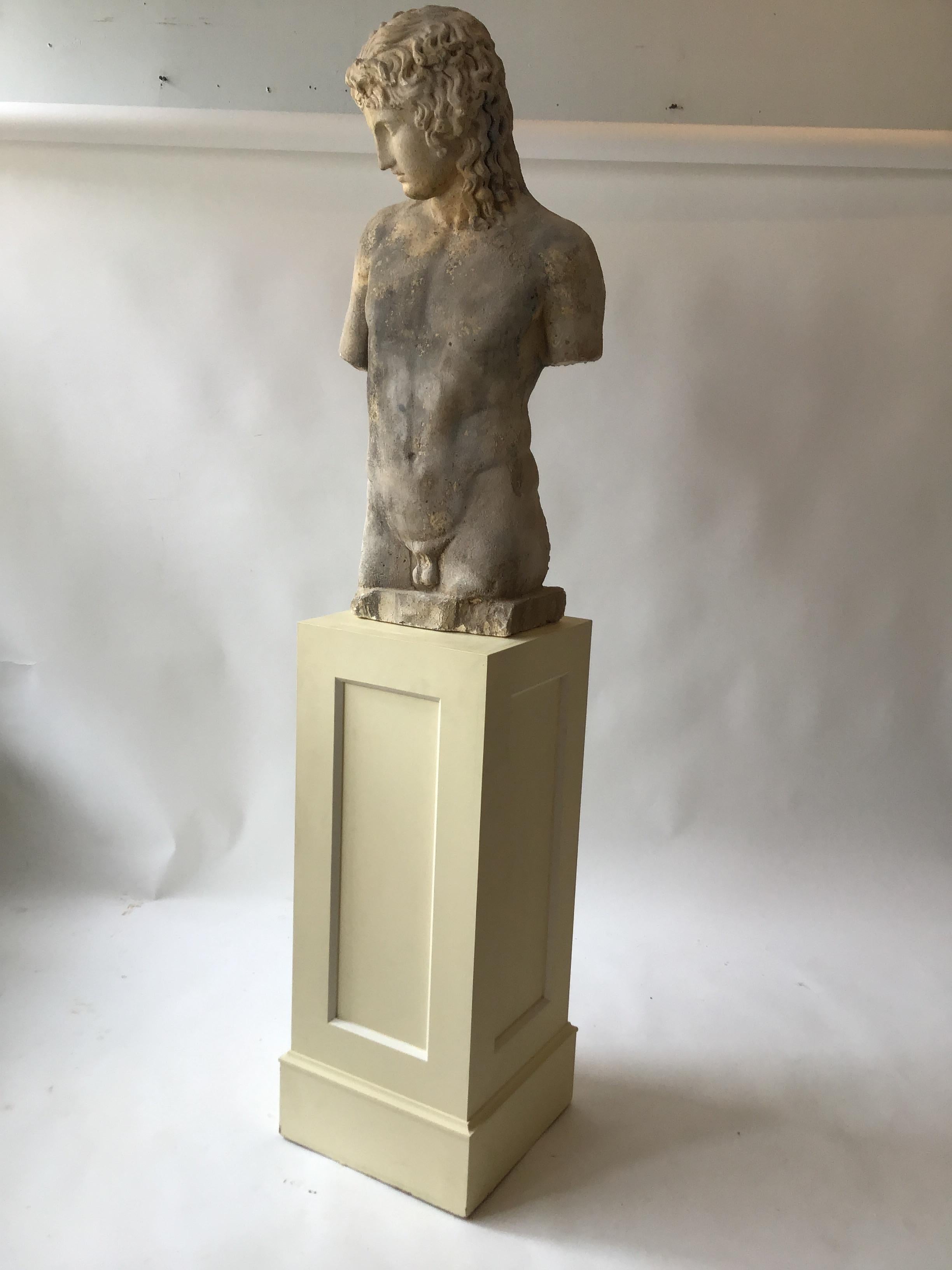 Cement figure of a Roman male on a wood pedestal. From a celebrities Southampton, NY oceanfront estate.