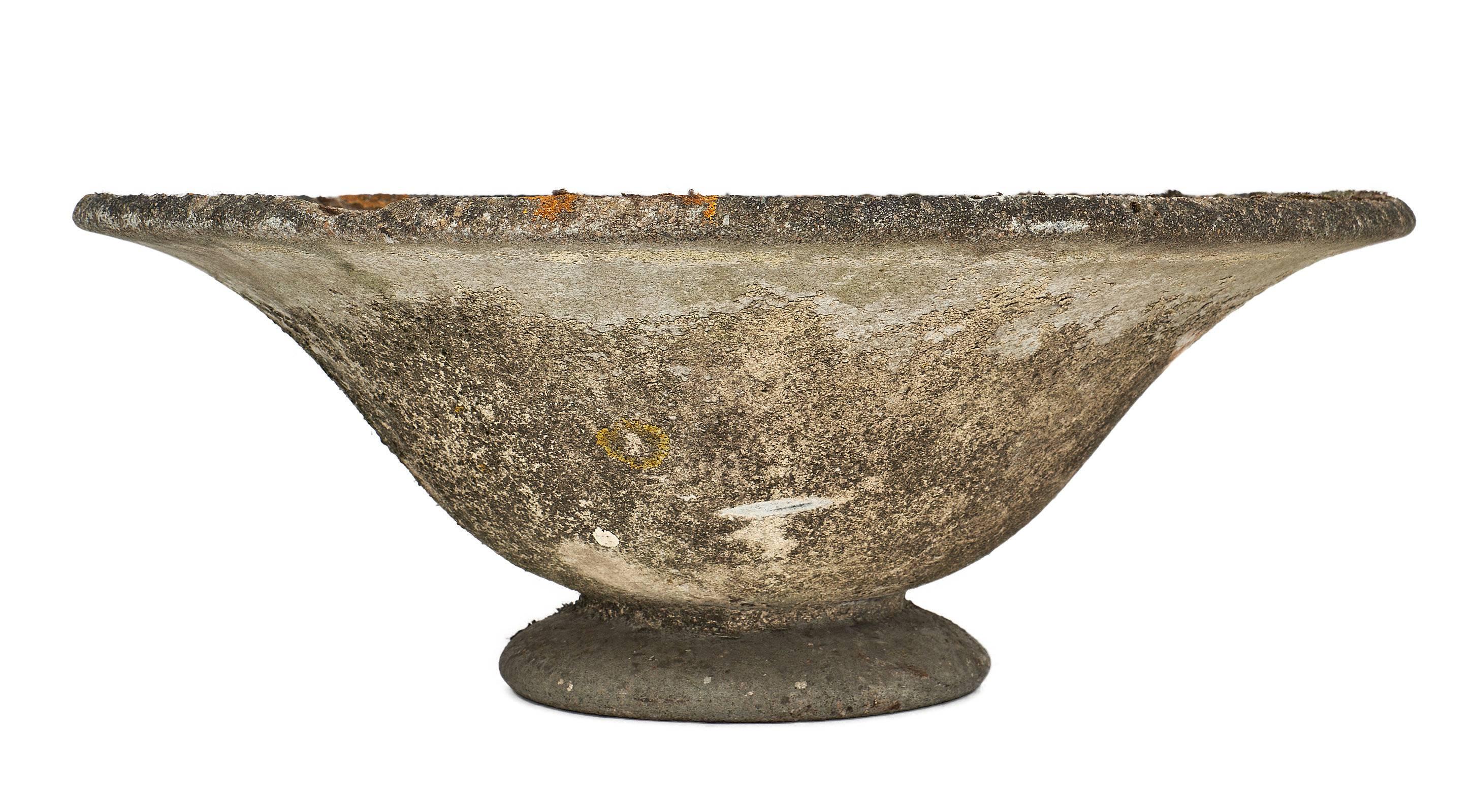 Round vintage French cement jardinière. It is intact and original from base to top lip; first free concrete form. We love the original patina and curved forms.