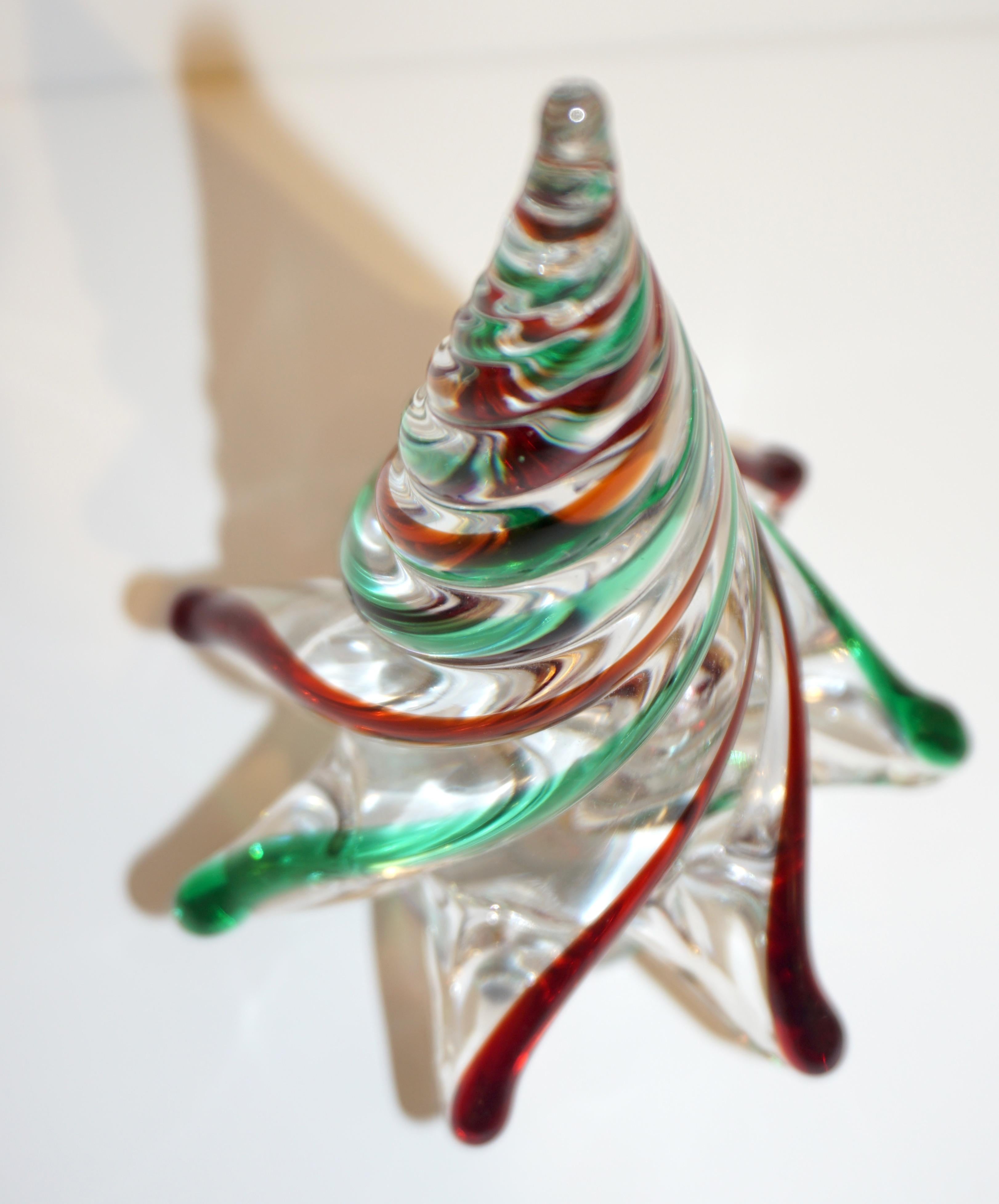 Murano glass tree of organic sleek modern design, a vintage creation signed by Cenedese Murano, individually mouth-blown and handcrafted. The crystal clear Murano glass is worked with a twisted technique to create an illusion of stylized pine