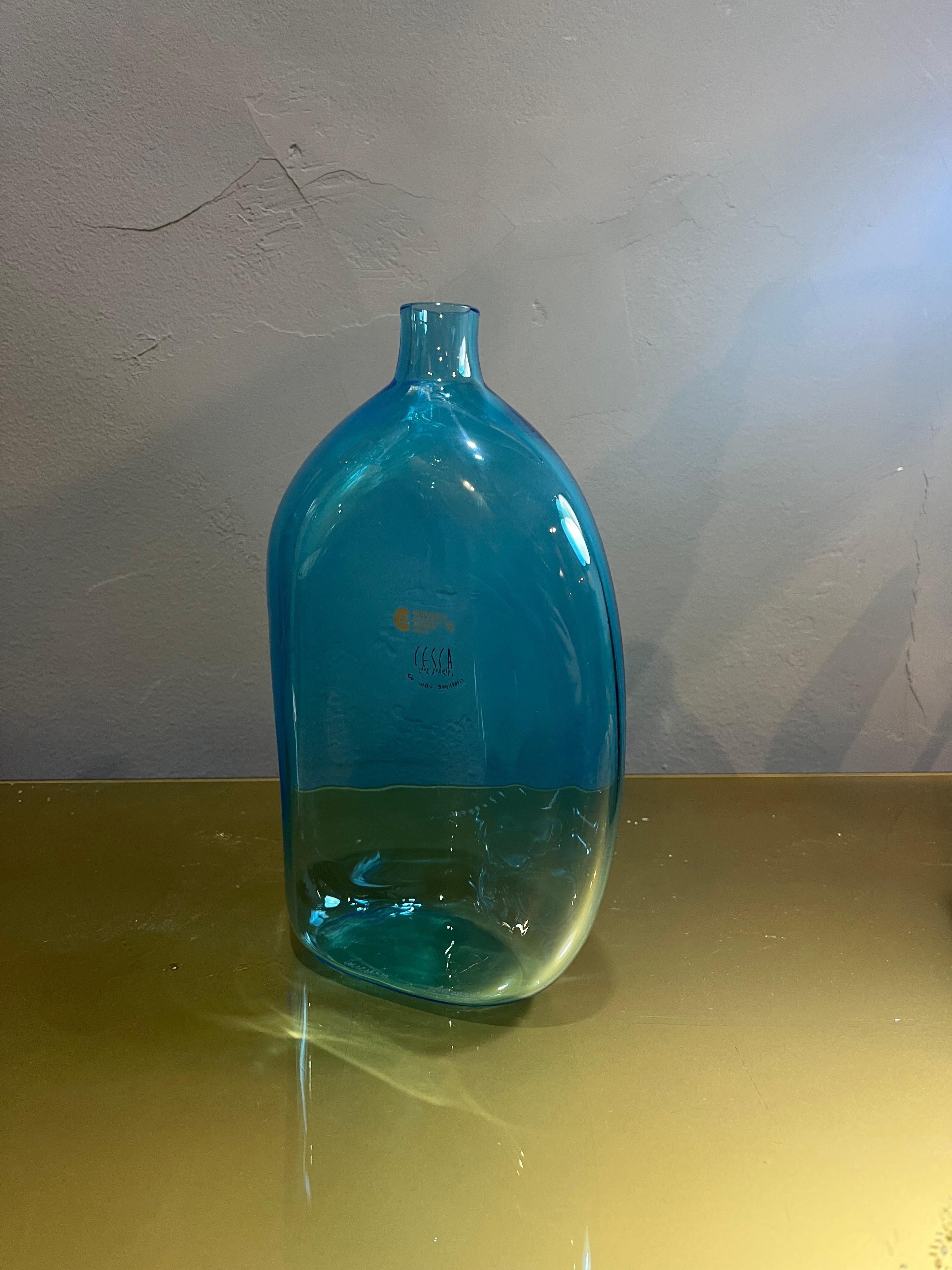 Cenedese & Albarelli bottle from the 60s in Murano glass. Product in good condition with small wear caused by the years and use. The story of Cenedese & Albarelli is a narrative that unites two worlds: that of artisan tradition and that of