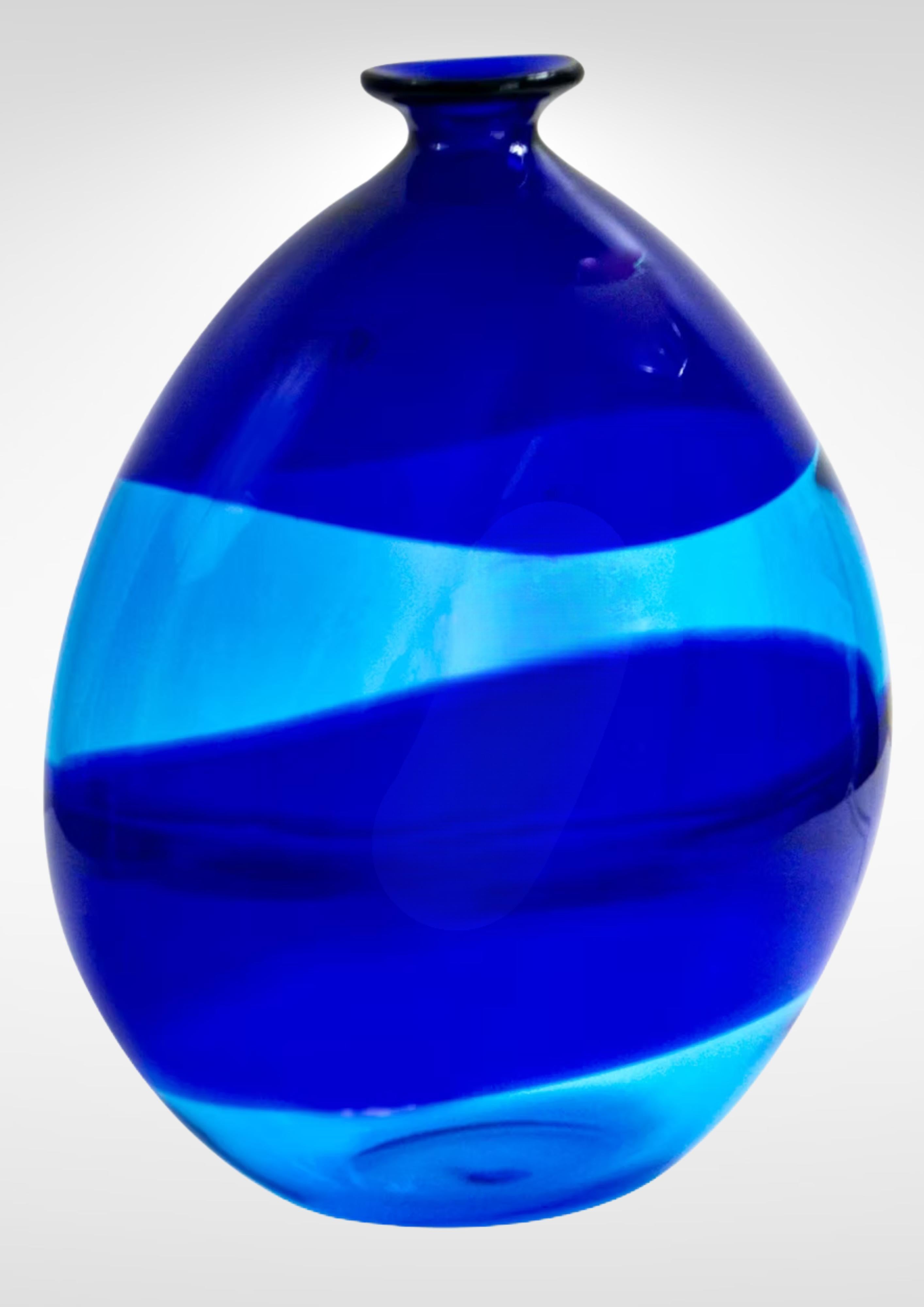 Cobalt blue glass vase designed by Gino Cenedese and Maurizio Albarelli for Cenedese et Albarelli, circa late 1970s.
Exquisite and striking piece..
Deep cobalt blue swirls interspaced with lighter shade of blue.
Label to the side and signed on the