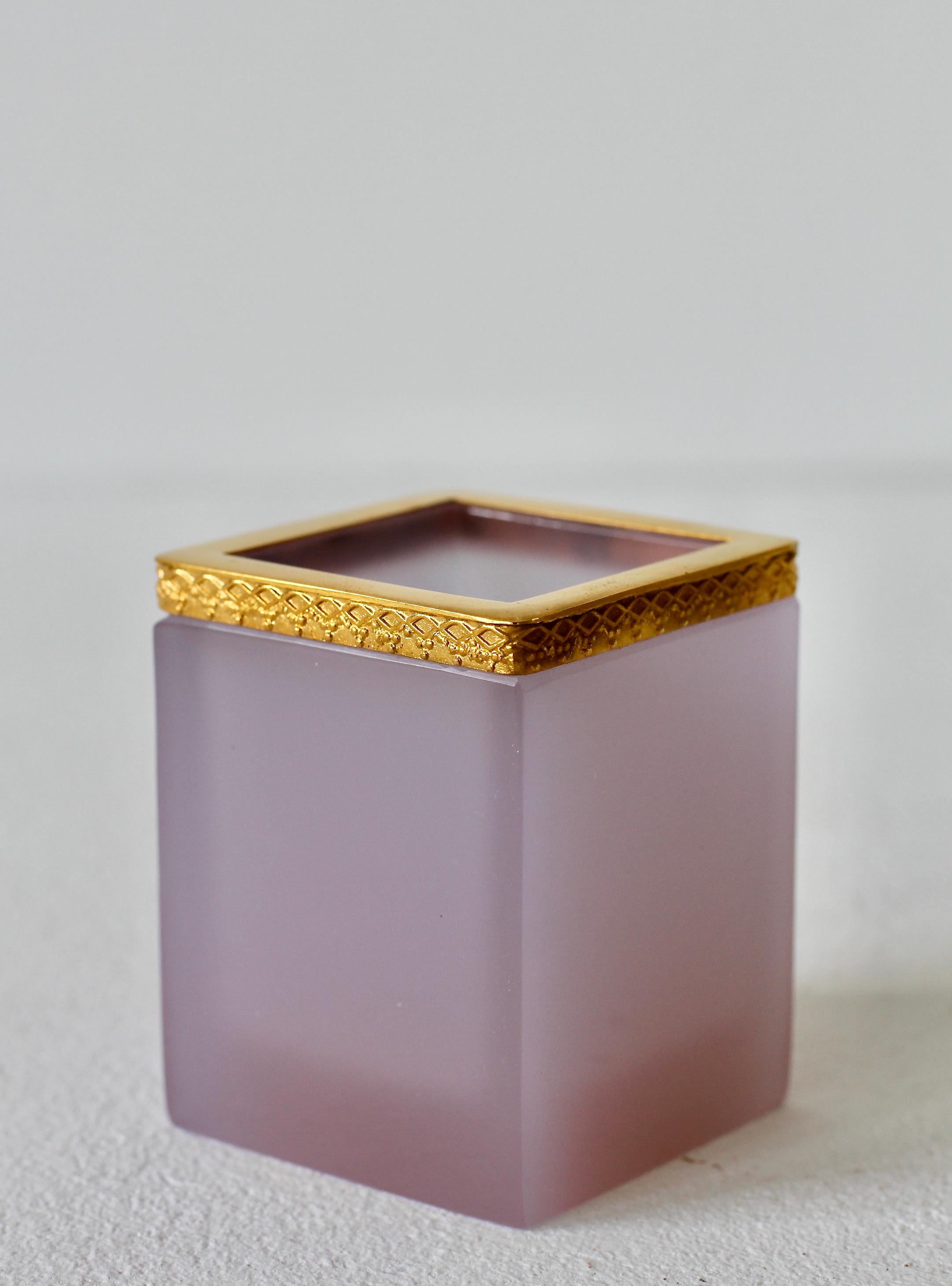 Mid-Century, vintage 'Opalino' Murano glass pen holder with an embossed gold plated rim attributed to Cenedese, circa 1950-1970. Wonderful translucent color of soft pink with a 24 carat gold-plated metal rim / edge. Simplistic yet elegant form. A