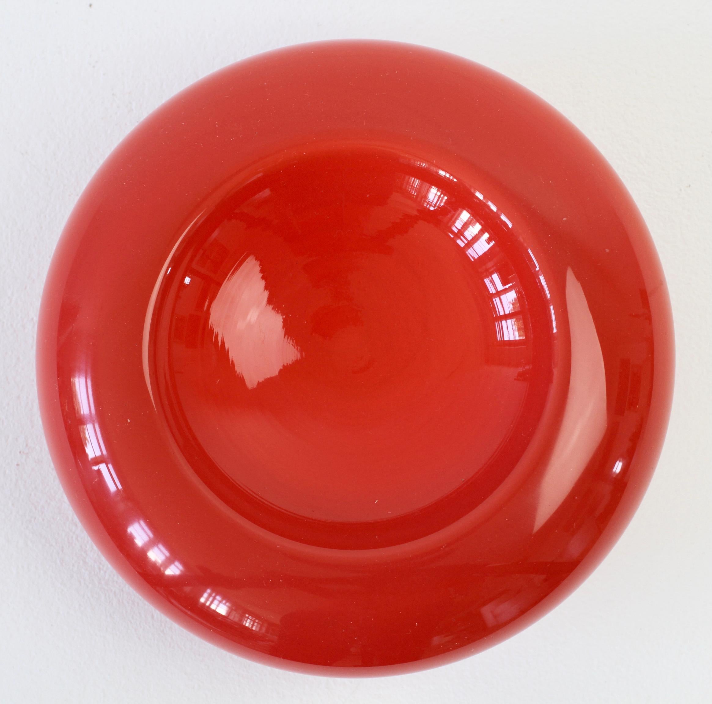 Wonderful vintage Mid-Century Modern glass bowl or vase in dark red by Cenedese of Murano, Italy. 

This can be used as a bowl or as a vase when turned upside down - perfect for displaying short stemmed decorative flowers.

A fun, funky and