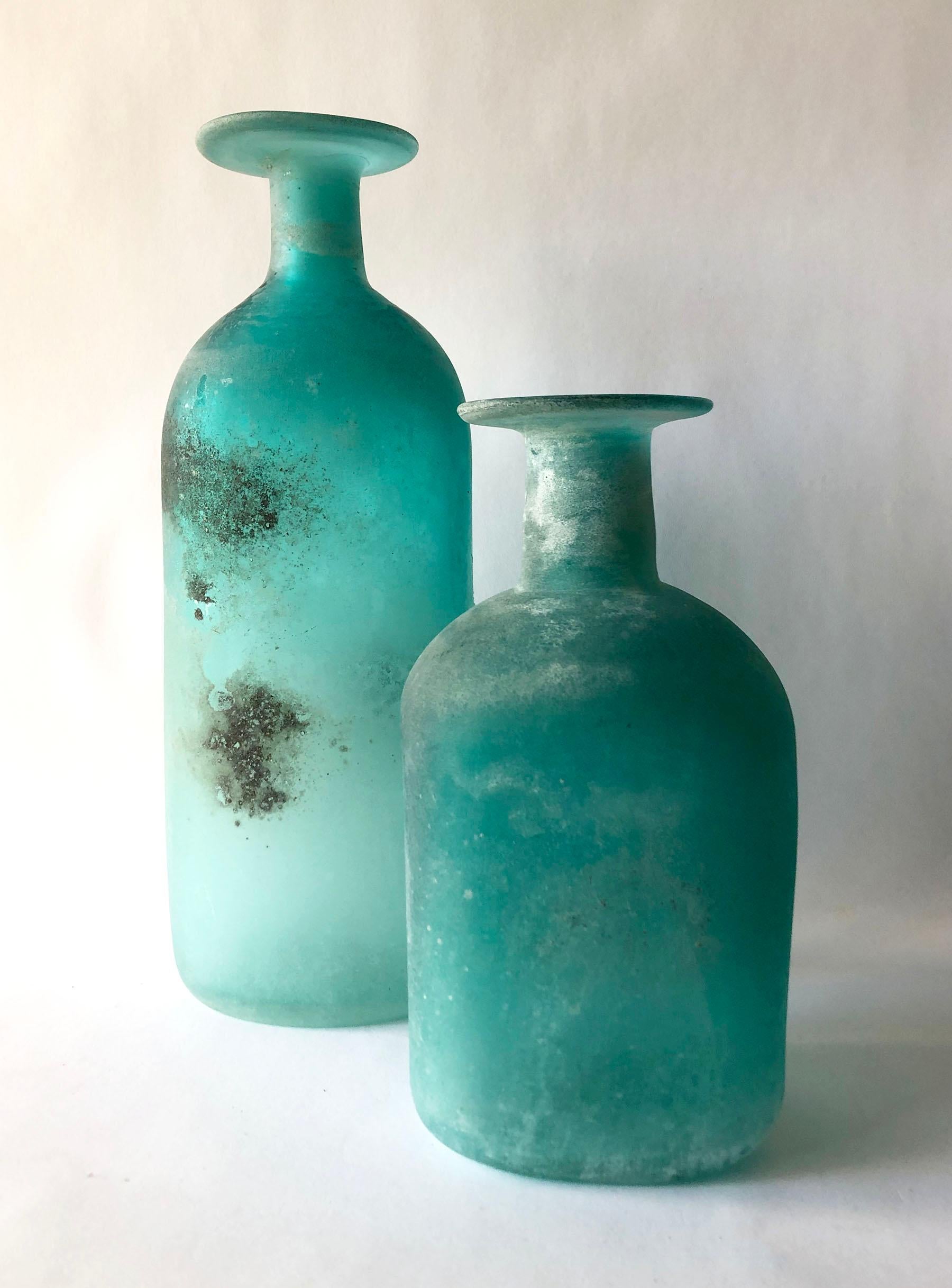 Pair of aqua bottle vases made in the 