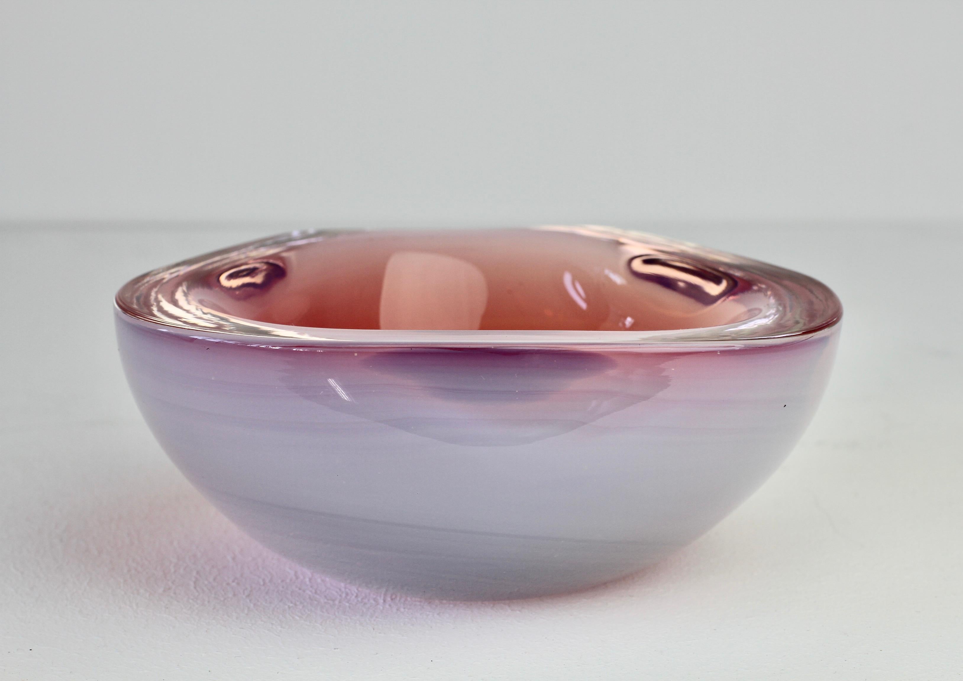 Cenedese vintage Italian Murano glass bowl, serving dish or ashtray, circa 1965-1975. Utilizing the Sommerso technique this large, heavy piece of glass features a triangular design of opaline white over pink toned glass to create a stunning centre