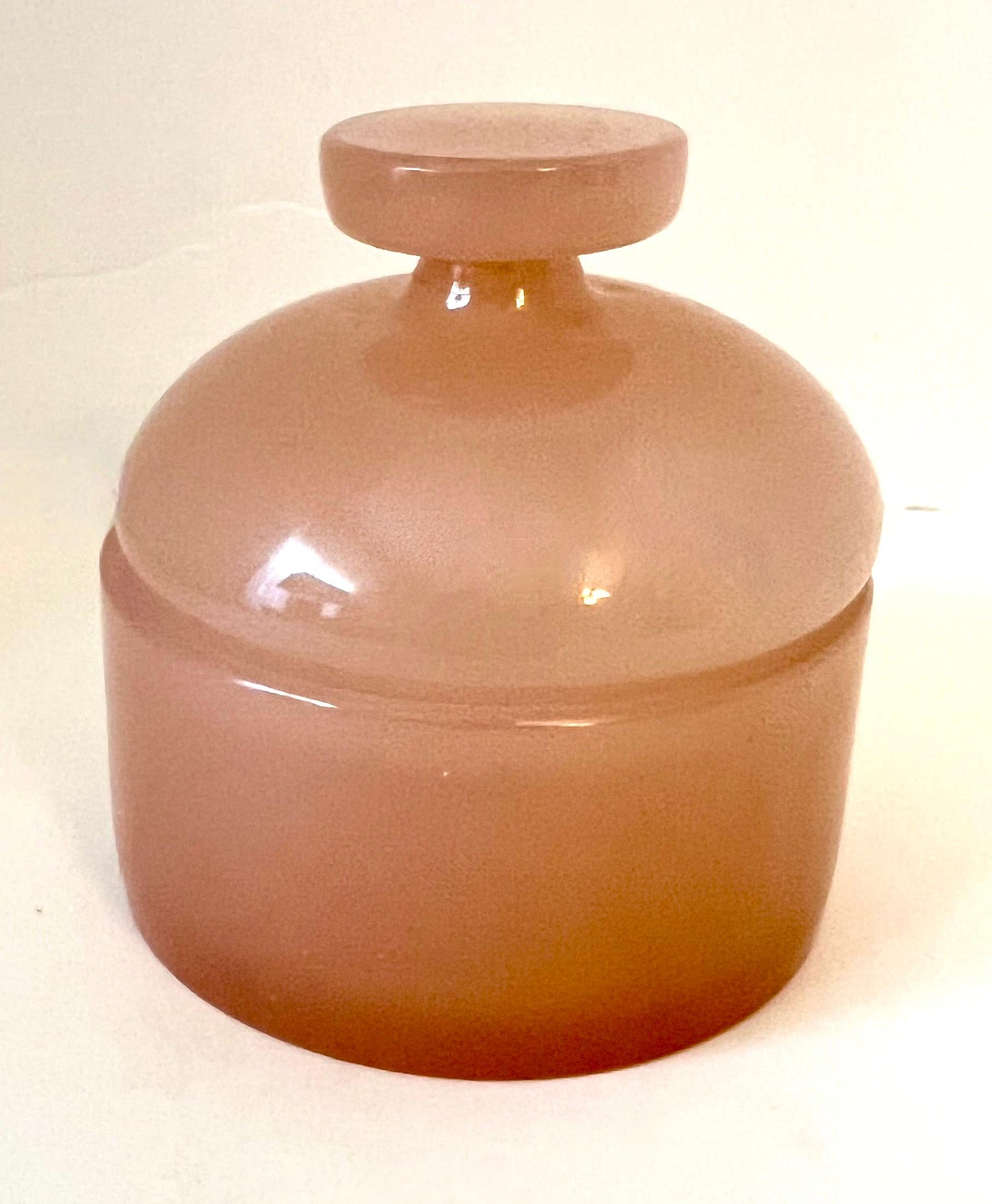 Hand Blown Italian Murano Cenedese apothecary Jar.  The piece is a unique shade of pink.  A compliment to any vanity, desk or work station.

Can hold anything from Candies, to cotton balls or rubber bands - functional or decorative.  A wonderfully