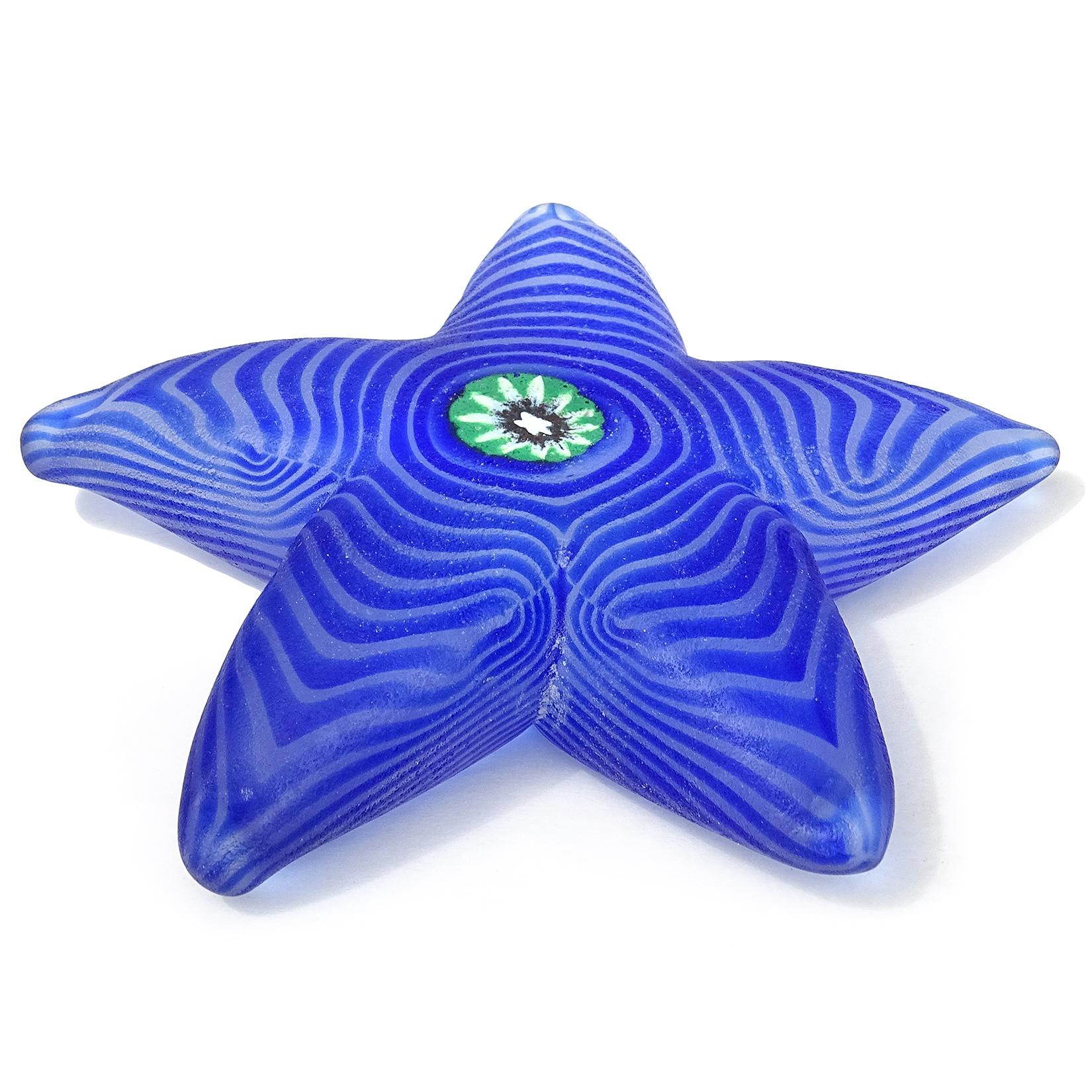 Beautiful vintage Murano hand blown cobalt blue swirl, and flower murrine Italian art glass starfish paperweight. Documented to the Cenedese company, signed underneath. Also has an original 