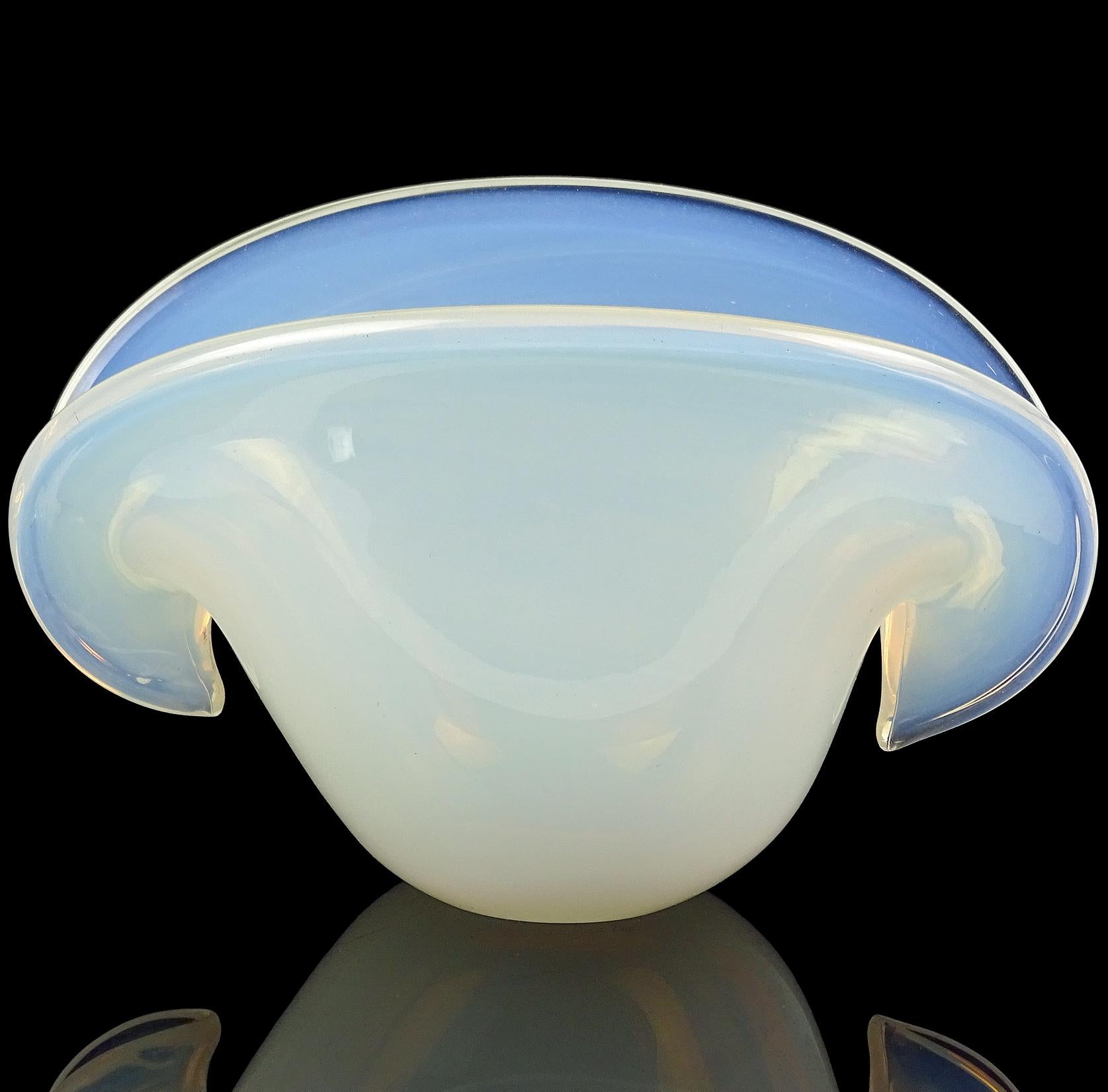 Beautiful Murano hand blown fiery white opalescent Italian art glass double position conch shell decorative vase / bowl. Documented to the Cenedese Company. When the light hits it, there is an orange cast (where the fiery comes from). Would be a