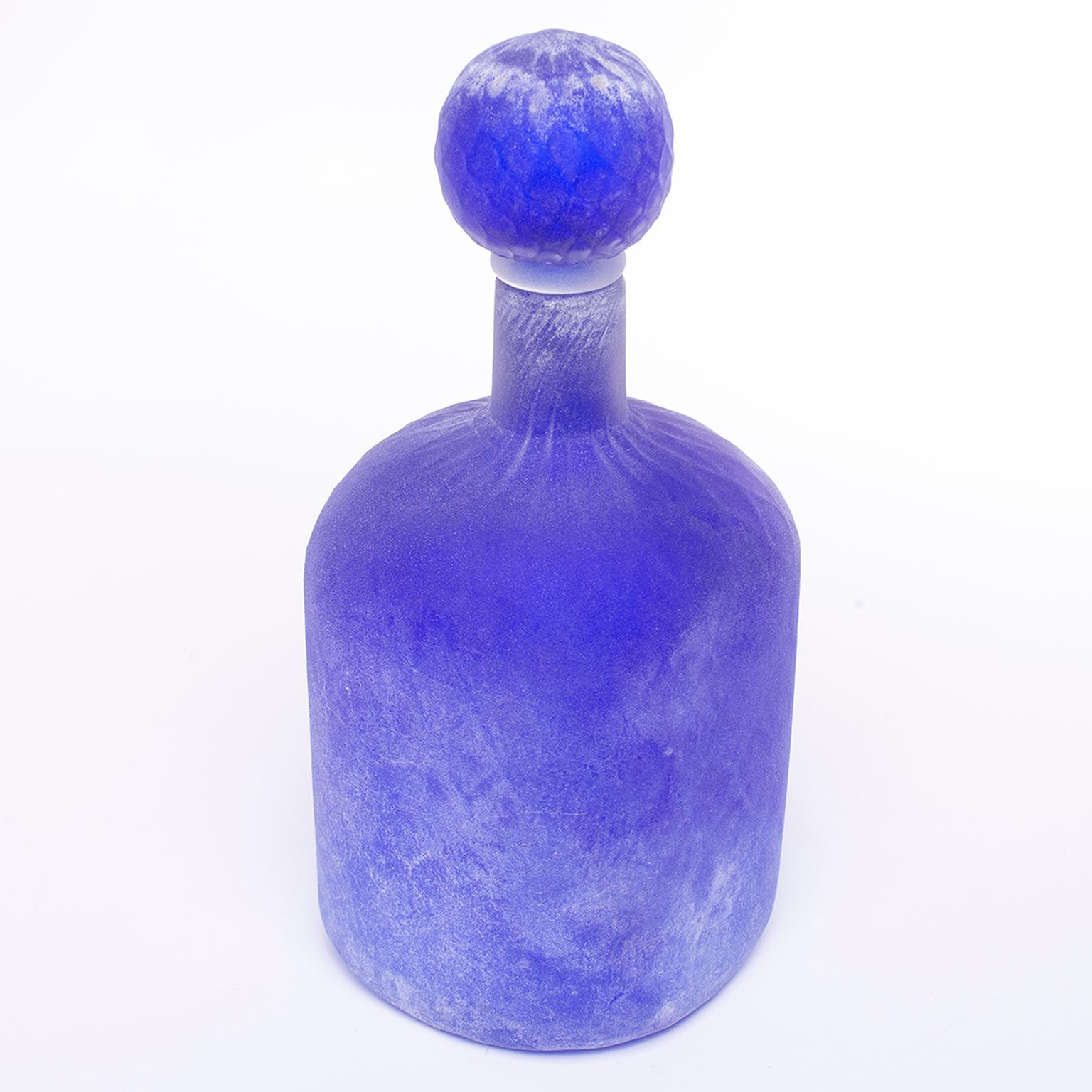 Blue Scavo style Murano glass bottle and stopper by Cenedese, circa 1970s. Original label still affixed. Excellent vintage condition with no flaws found.