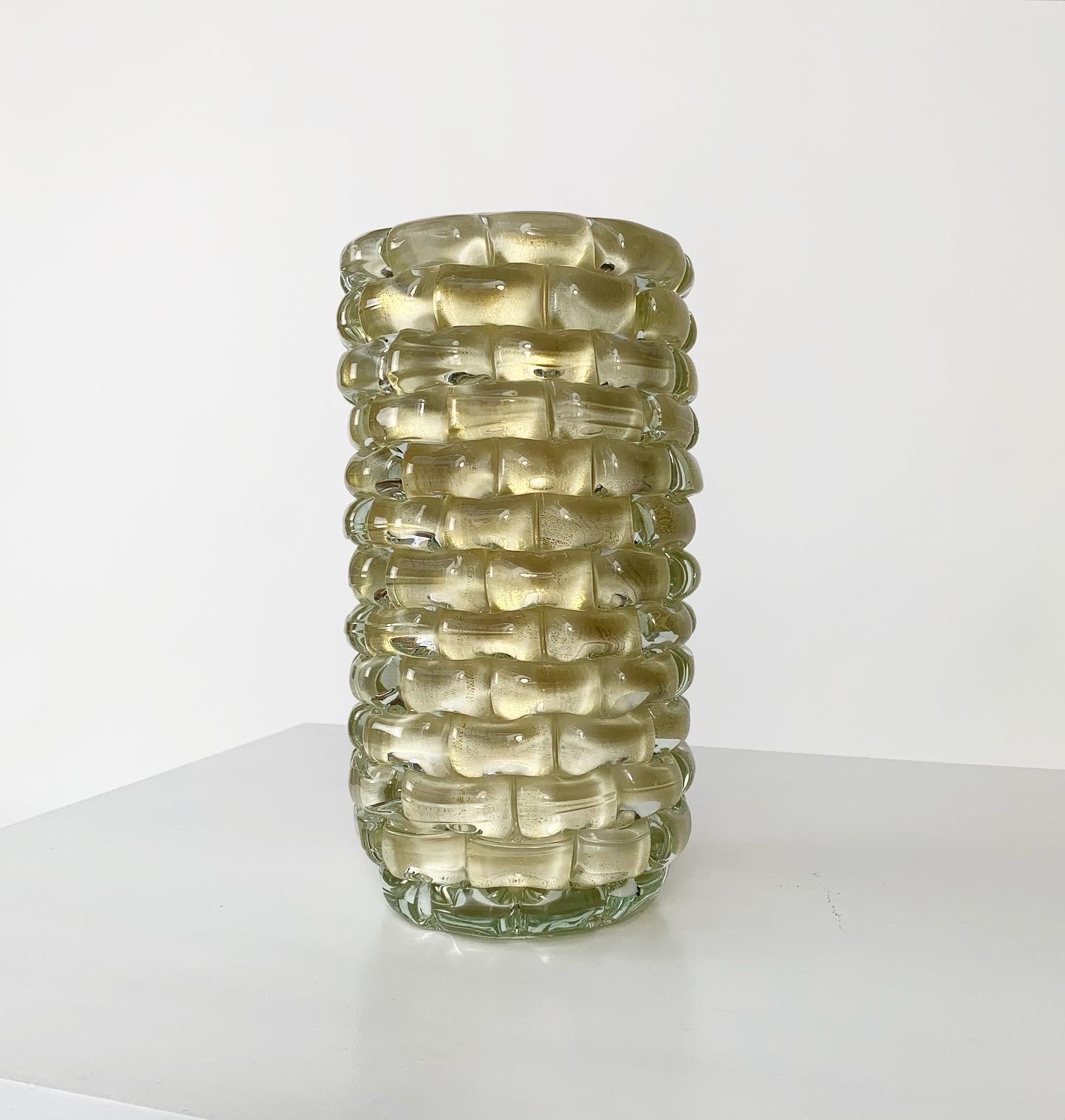 Beautiful heavy Murano glass vase by Cenedese, hand-crafted in Italy in the 1980s. Cream colored interior with applied glass pieces over gold foil, similar to the 'rostrato' technique. 

This piece is signed 