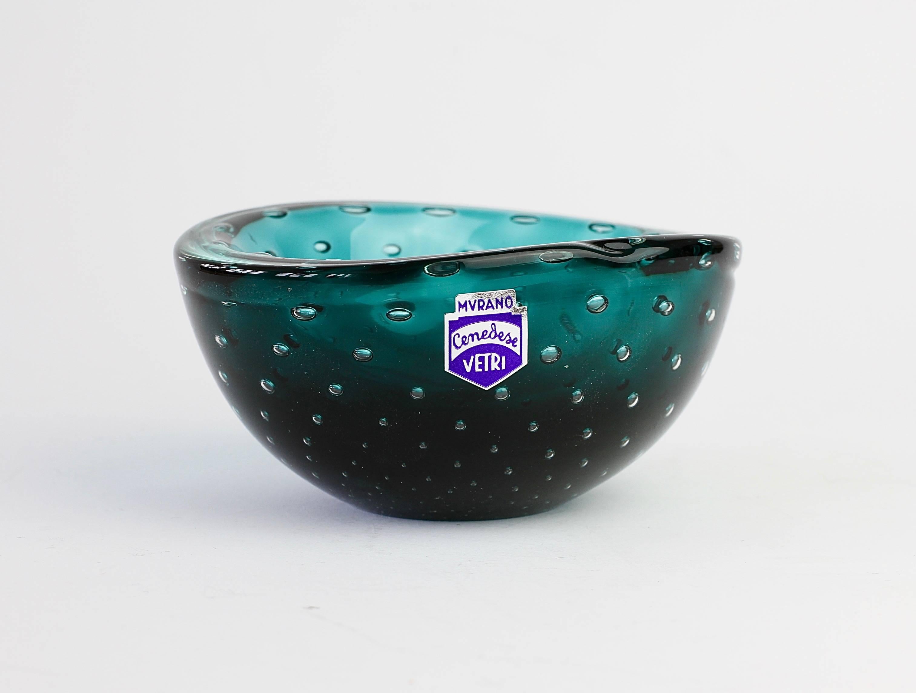Small petite little Italian bowl, dish or ashtray by Cenedese but in the style of works by Carlo Scarpa for Venini. Made from green Murano glass bullicante or 