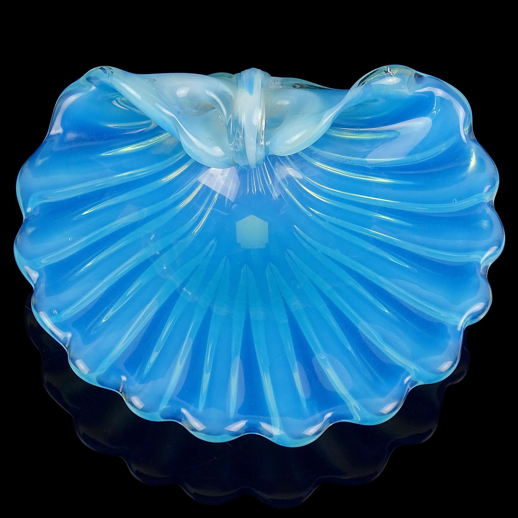 Beautiful vintage Murano hand blown opalescent blue and white Italian art glass seashell bowl. Documented to the Cenedese Company. It has the original underneath 