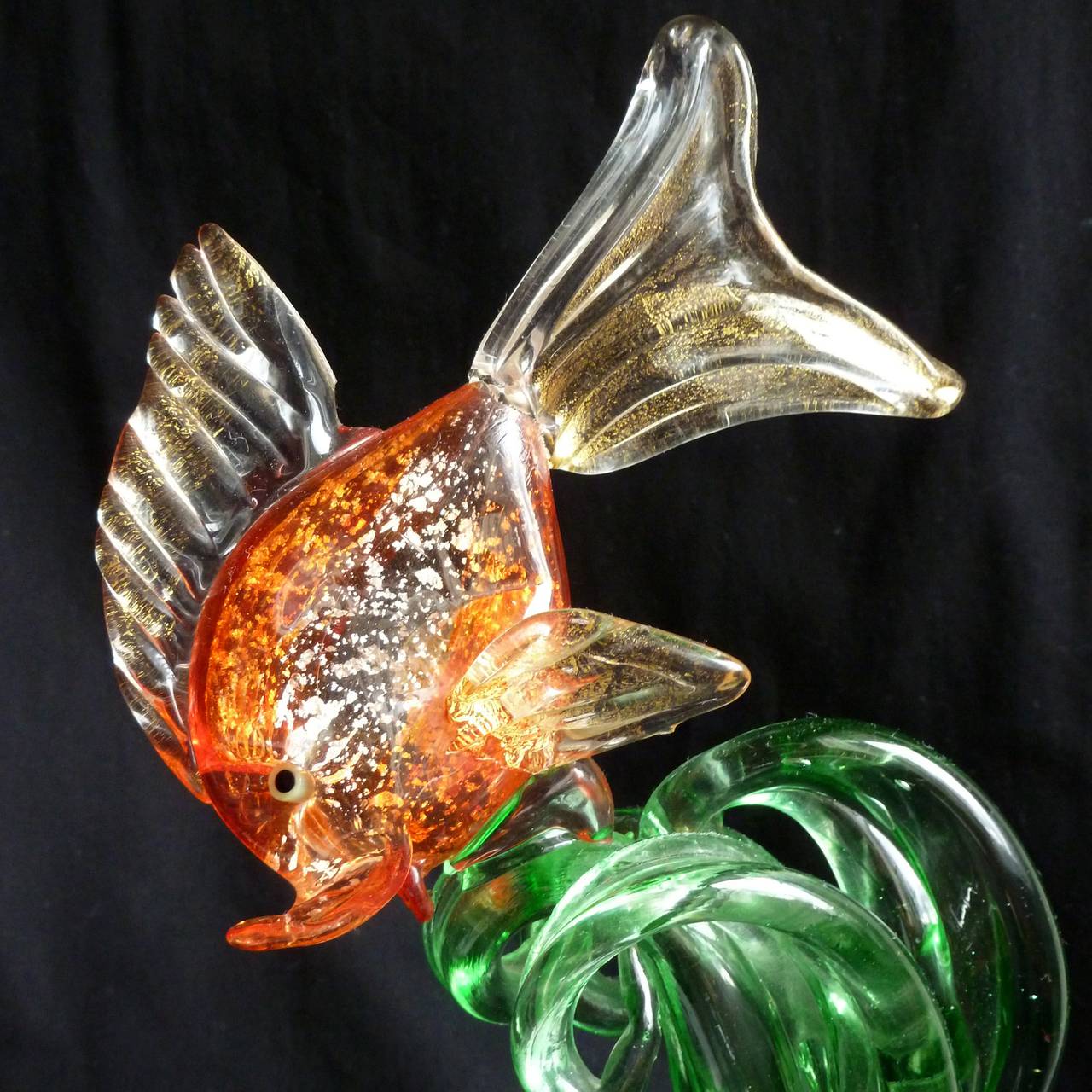 Beautiful vintage Murano hand blown orange, silver and gold flecks Italian art glass fish on wave of algae sculpture. Documented to the Cenedese company. Very unusual 3 dimensional figure. Can be used as a display piece on any table. Mid-century
