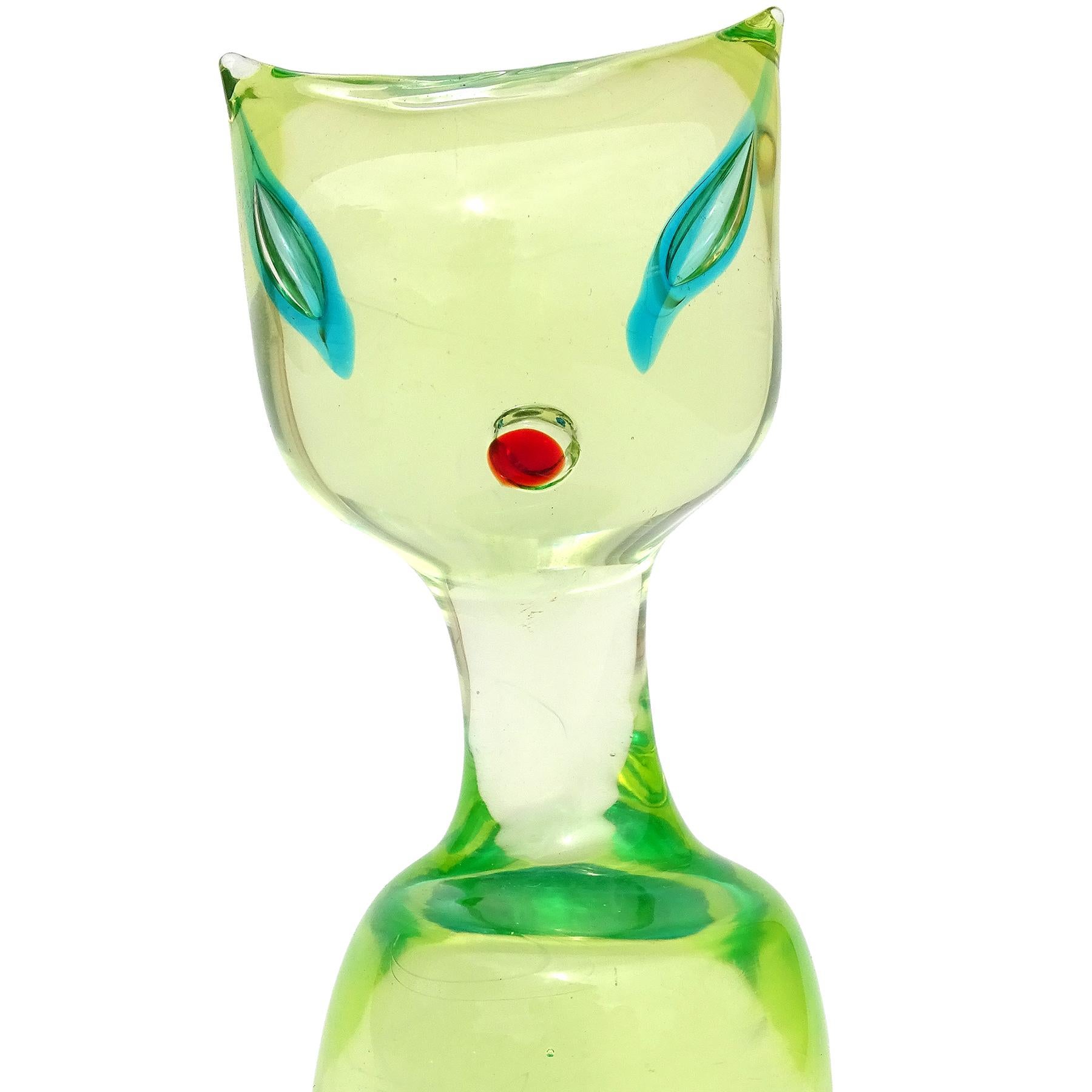 Beautiful and cute, vintage Murano hand blown Sommerso glowing Uranium yellow green with blue Italian art glass kitty cat figure / sculpture. The cat is documented to the Cenedese company, and attributed to designer Antonio da Ros. The cat an