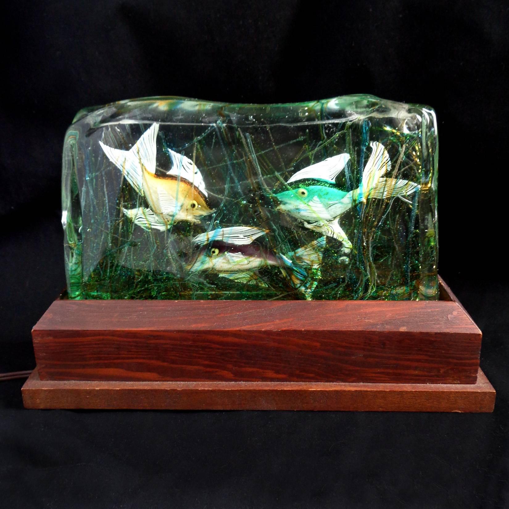 Gorgeous large vintage Murano handblown orange, turquoise, and purple fish Italian art glass aquarium sculpture on original lighted wood base. Attributed to designer Alfredo Barbini for the Cenedese Company. All three fish have gold flecks over