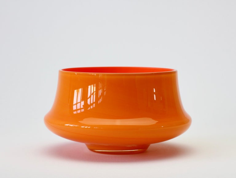 Cenedese bright orange Murano glass vase, bowl or vessel made in Venice, Italy. Particularly striking is the form, as it has the characteristics of hand thrown pottery with the unmistakable look and feel of glass.

A fun, funky and bright way to